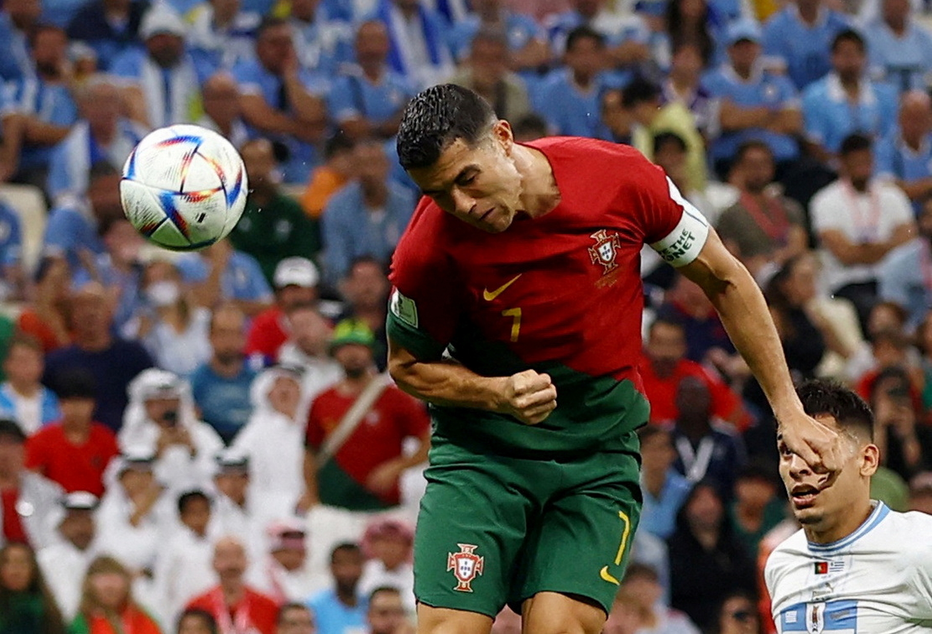 Soccer Football - FIFA World Cup Qatar 2022 - Group H - Portugal v Uruguay - Lusail Stadium, Lusail, Qatar - November 28, 2022 Portugal's Cristiano Ronaldo attempts to head at goal as Bruno Fernandes scores their first goal REUTERS