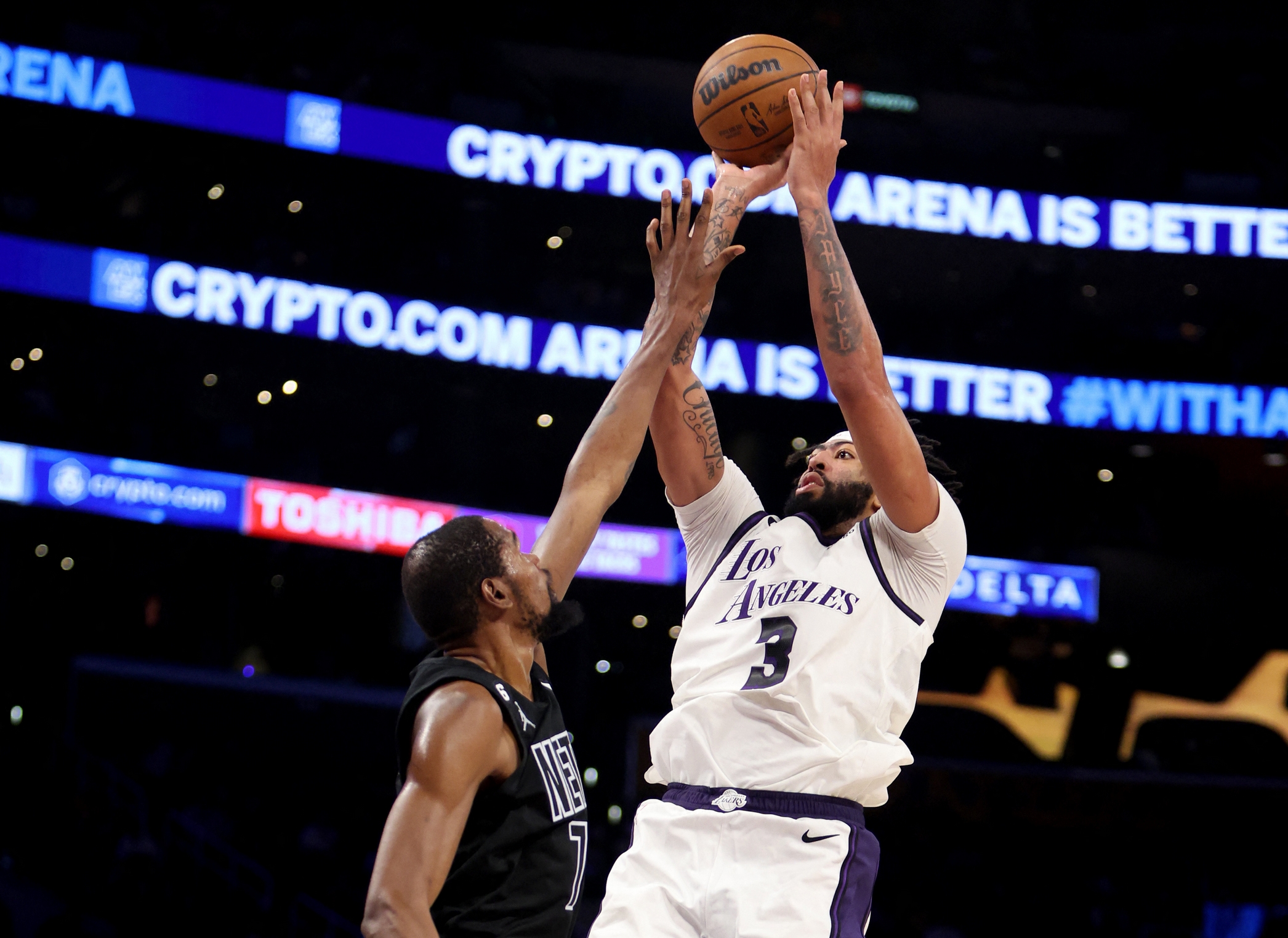 Nov 13, 2022; Los Angeles, California, USA;  Los Angeles Lakers forward Anthony Davis (3) shoots over Brooklyn Nets forward Kevin Durant (7) during the third quarter at Crypto.com Arena. Mandatory Credit: Kiyoshi Mio-USA TODAY Sports