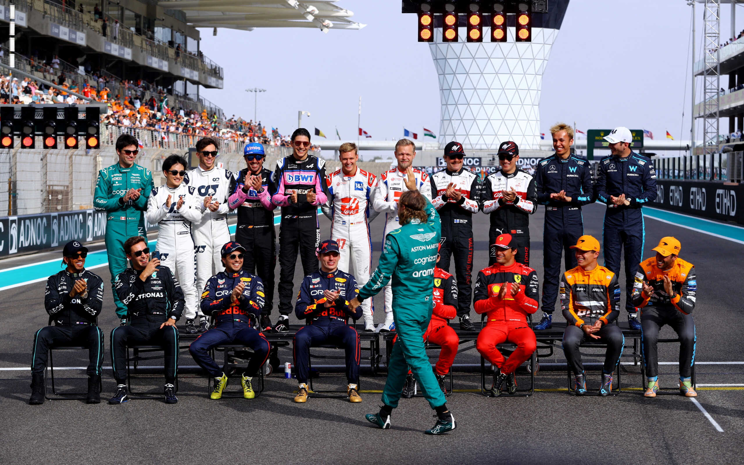 Formula One F1 - Abu Dhabi Grand Prix - Yas Marina Circuit, Abu Dhabi, United Arab Emirates - November 20, 2022 Aston Martin's Sebastian Vettel waves to fans as the drivers applaud before posing for a photo ahead of the race REUTERS