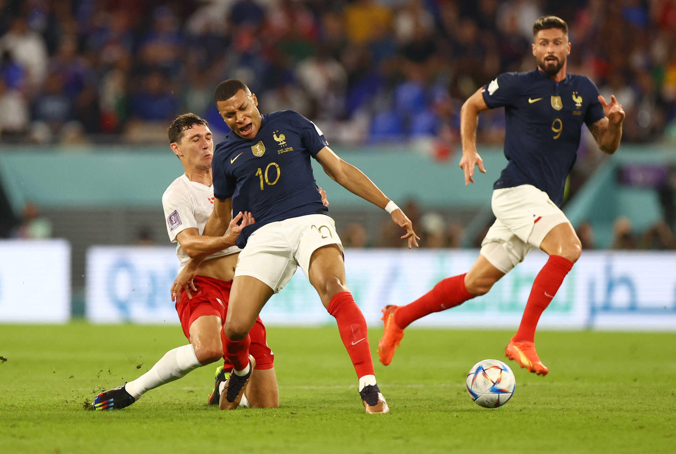 Soccer Football - FIFA World Cup Qatar 2022 - Group D - France v Denmark - Stadium 974, Doha, Qatar - November 26, 2022 Denmark's Andreas Christensen fouls France's Kylian Mbappe and subsequently receives a yellow card REUTERS