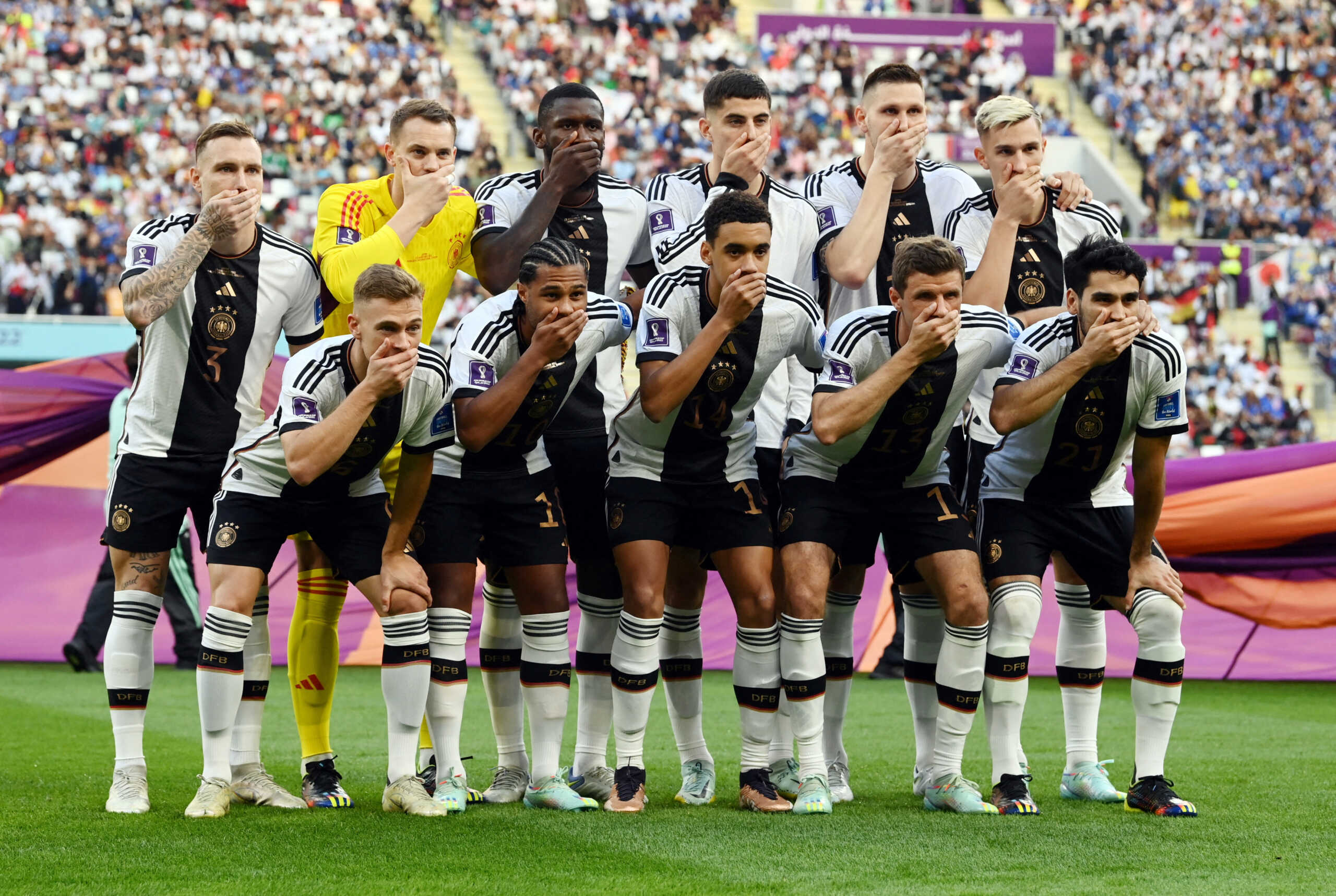 Soccer Football - FIFA World Cup Qatar 2022 - Group E - Germany v Japan - Khalifa International Stadium, Doha, Qatar - November 23, 2022 Germany players cover their mouths as they pose for a team group photo before the match REUTERS
