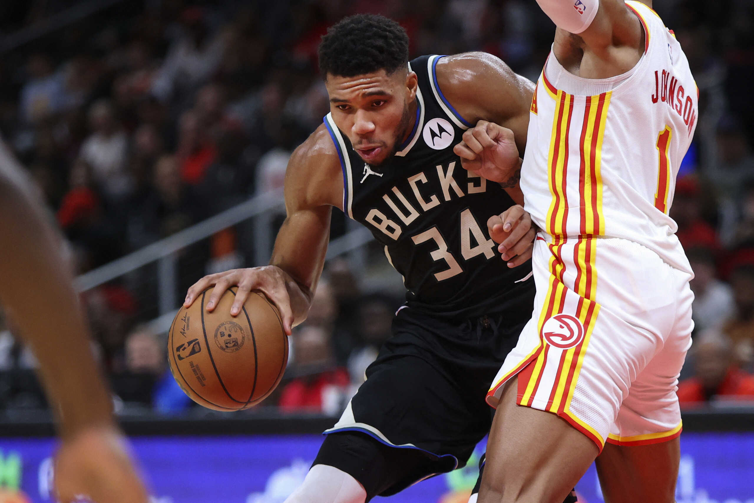 Nov 7, 2022; Atlanta, Georgia, USA; Milwaukee Bucks forward Giannis Antetokounmpo (34) is defended by Atlanta Hawks forward Jalen Johnson (1) in the fourth quarter at State Farm Arena. Mandatory Credit: Brett Davis-USA TODAY Sports