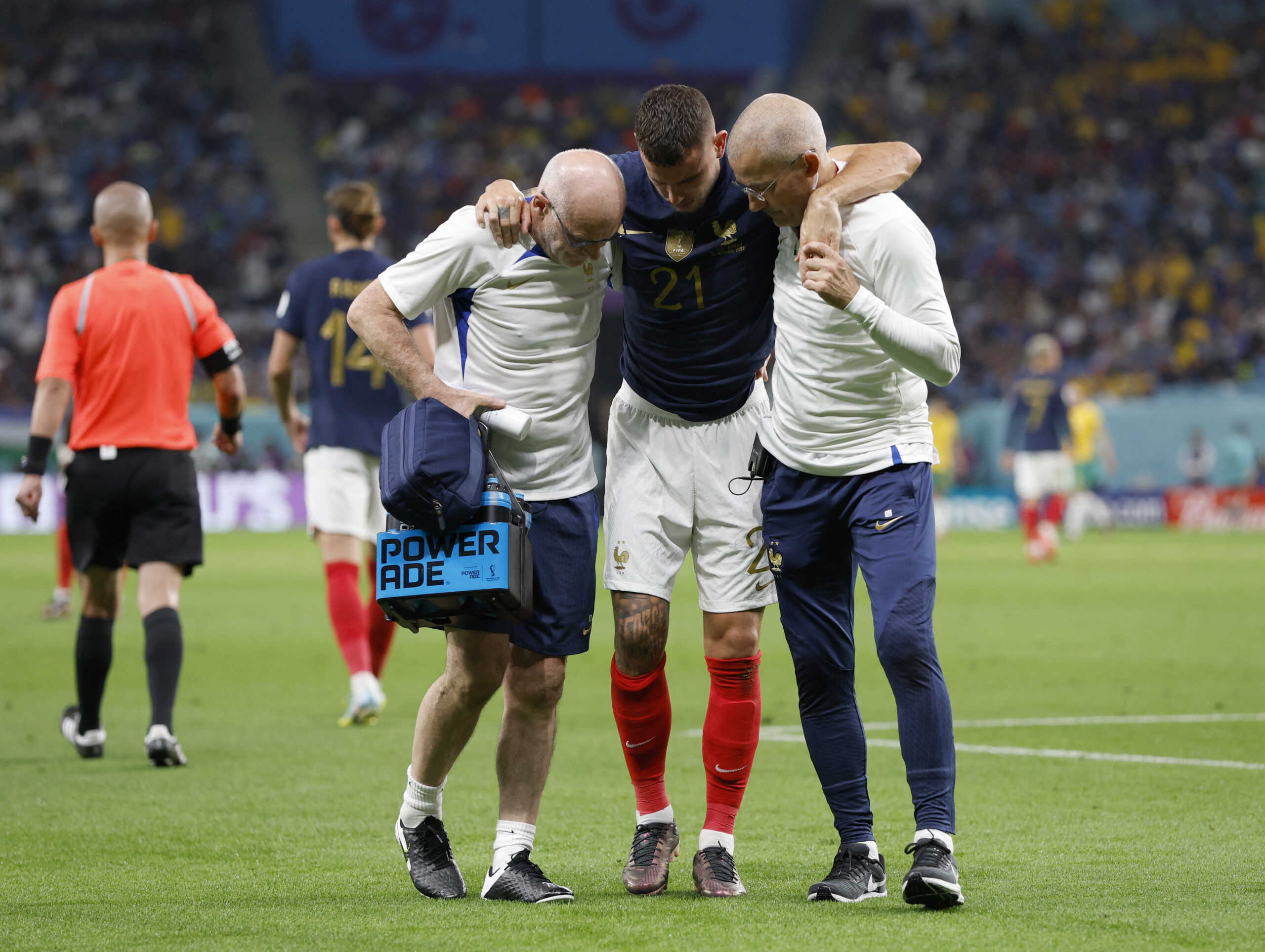 Soccer Football - FIFA World Cup Qatar 2022 - Group D - France v Australia - Al Janoub Stadium, Al Wakrah, Qatar - November 22, 2022  France's Lucas Hernandez is helped off the pitch after sustaining an injury REUTERS