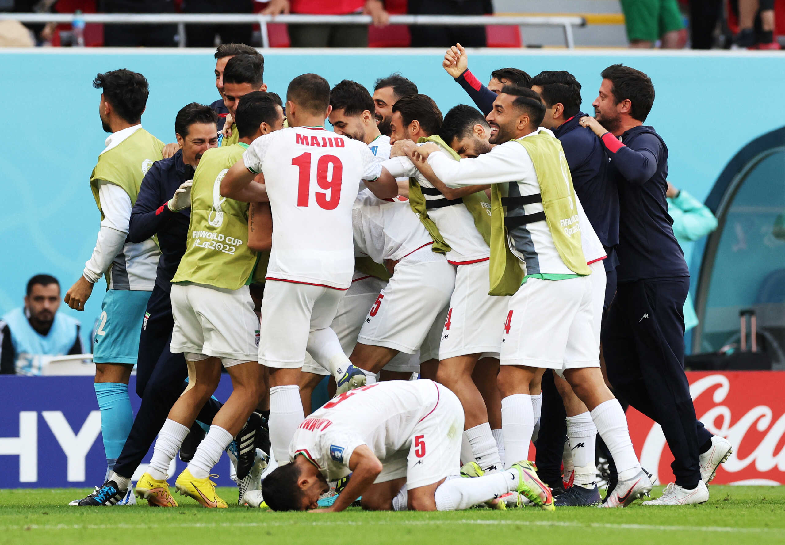Soccer Football - FIFA World Cup Qatar 2022 - Group B - Wales v Iran - Ahmad Bin Ali Stadium, Al Rayyan, Qatar - November 25, 2022 Iran's Roozbeh Cheshmi celebrates scoring their first goal with teammates REUTERS