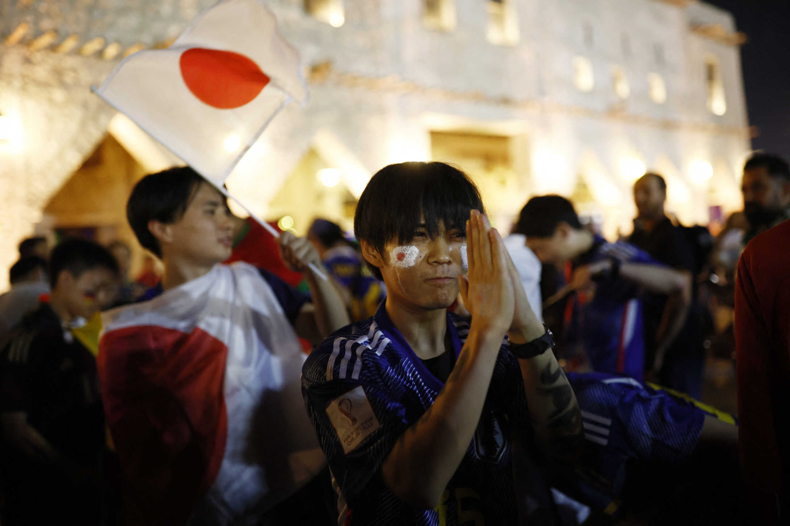 Soccer Football - FIFA World Cup Qatar 2022 - Doha, Qatar - November 23, 2022 Japan fans are seen celebrating in Souq Waqif after beating Germany REUTERS
