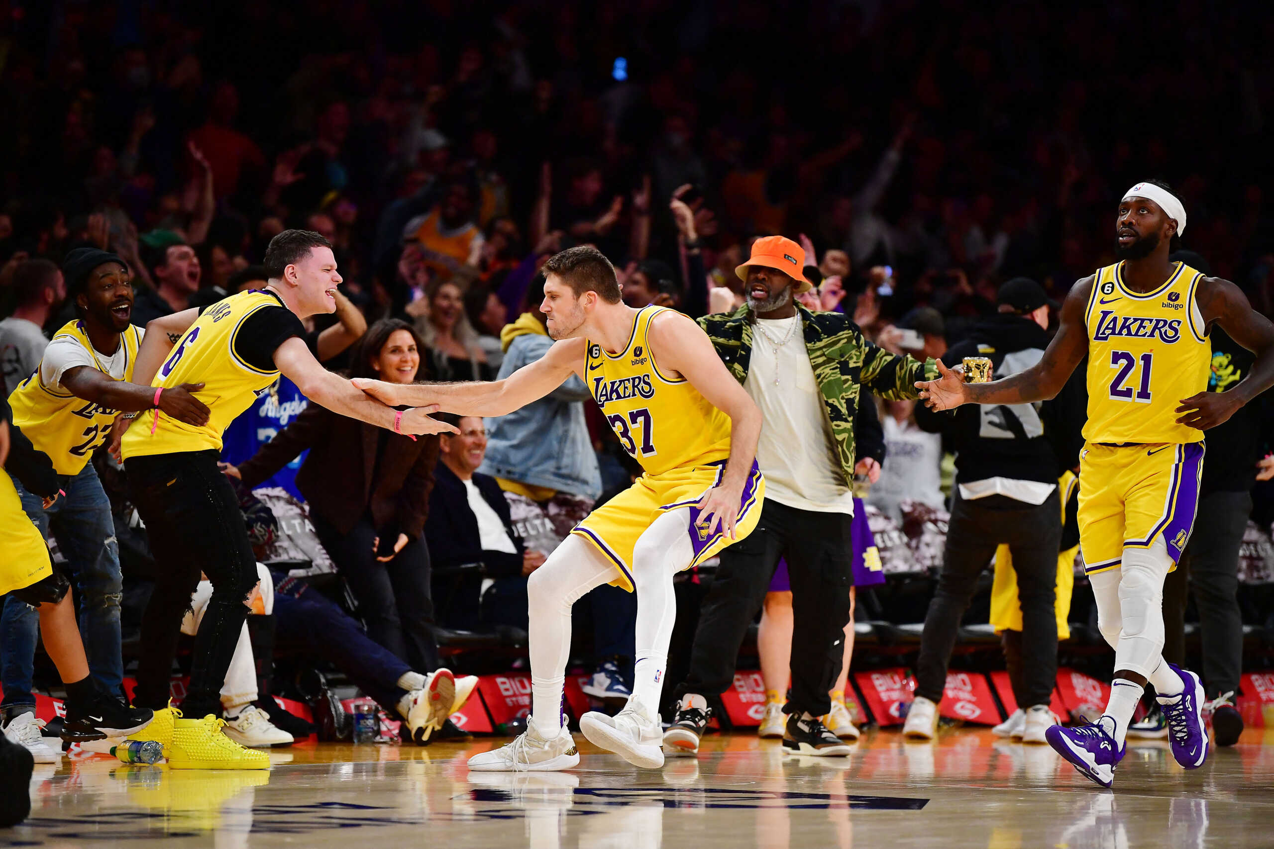 Nov 2, 2022; Los Angeles, California, USA; Los Angeles Lakers forward Matt Ryan (37) reacts with fans after scoring a three point basket to send the game into overtime during the second half at Crypto.com Arena. Mandatory Credit: Gary A. Vasquez-USA TODAY Sports