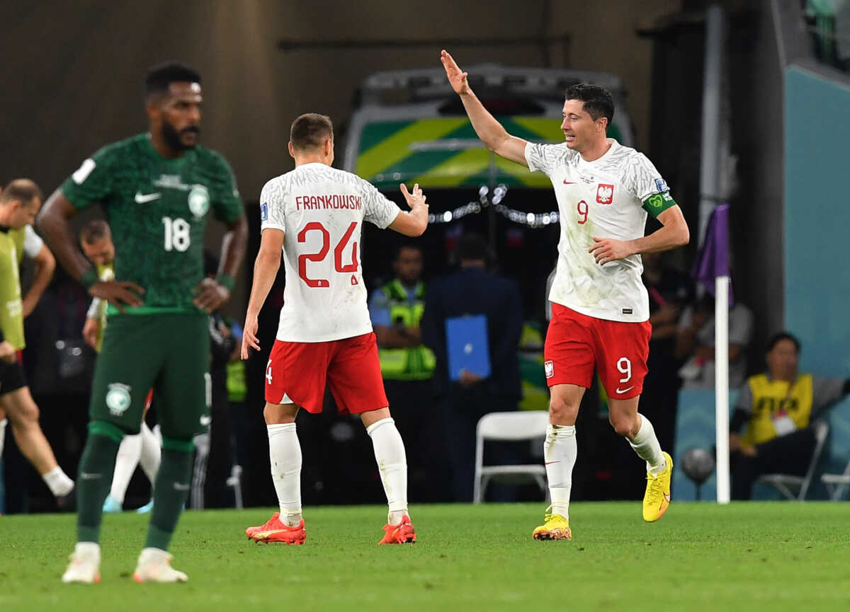 Soccer Football - FIFA World Cup Qatar 2022 - Group C - Poland v Saudi Arabia - Education City Stadium, Al Rayyan, Qatar - November 26, 2022 Poland's Robert Lewandowski celebrates scoring their second goal with Przemyslaw Frankowski REUTERS
