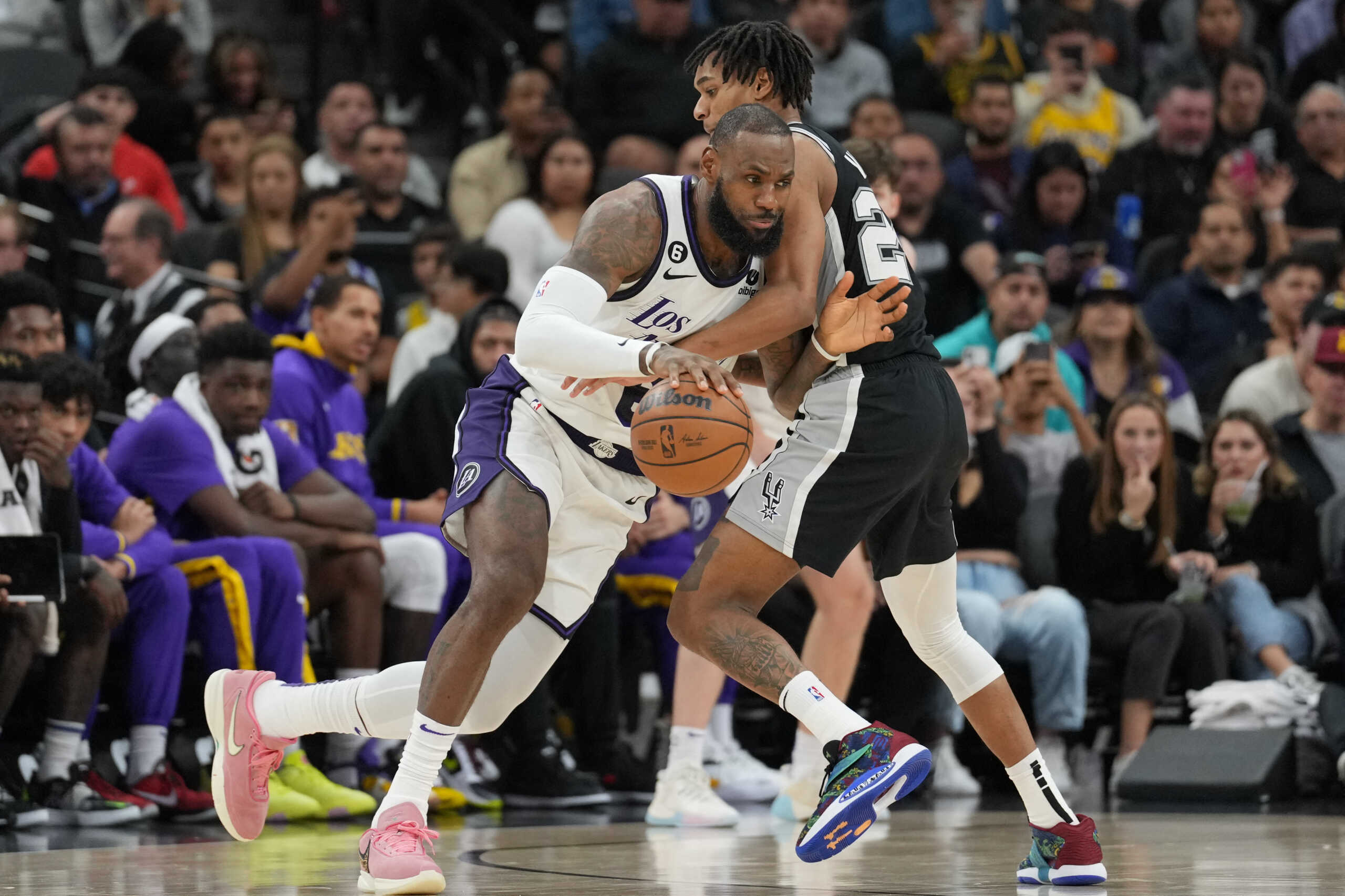 Nov 26, 2022; San Antonio, Texas, USA;  Los Angeles Lakers forward LeBron James (6) dribbles in against San Antonio Spurs guard Devin Vassell (24) in the second half at the AT&T Center. Mandatory Credit: Daniel Dunn-USA TODAY Sports