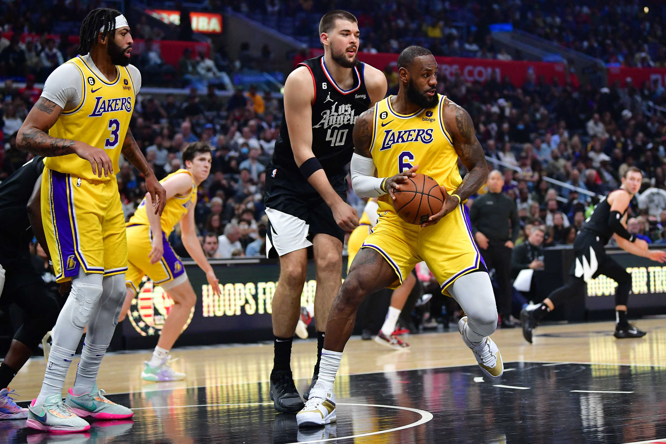 Nov 9, 2022; Los Angeles, California, USA; Los Angeles Lakers forward LeBron James (6) controls the ball against Los Angeles Clippers center Ivica Zubac (40) during the second half at Crypto.com Arena. Mandatory Credit: Gary A. Vasquez-USA TODAY Sports