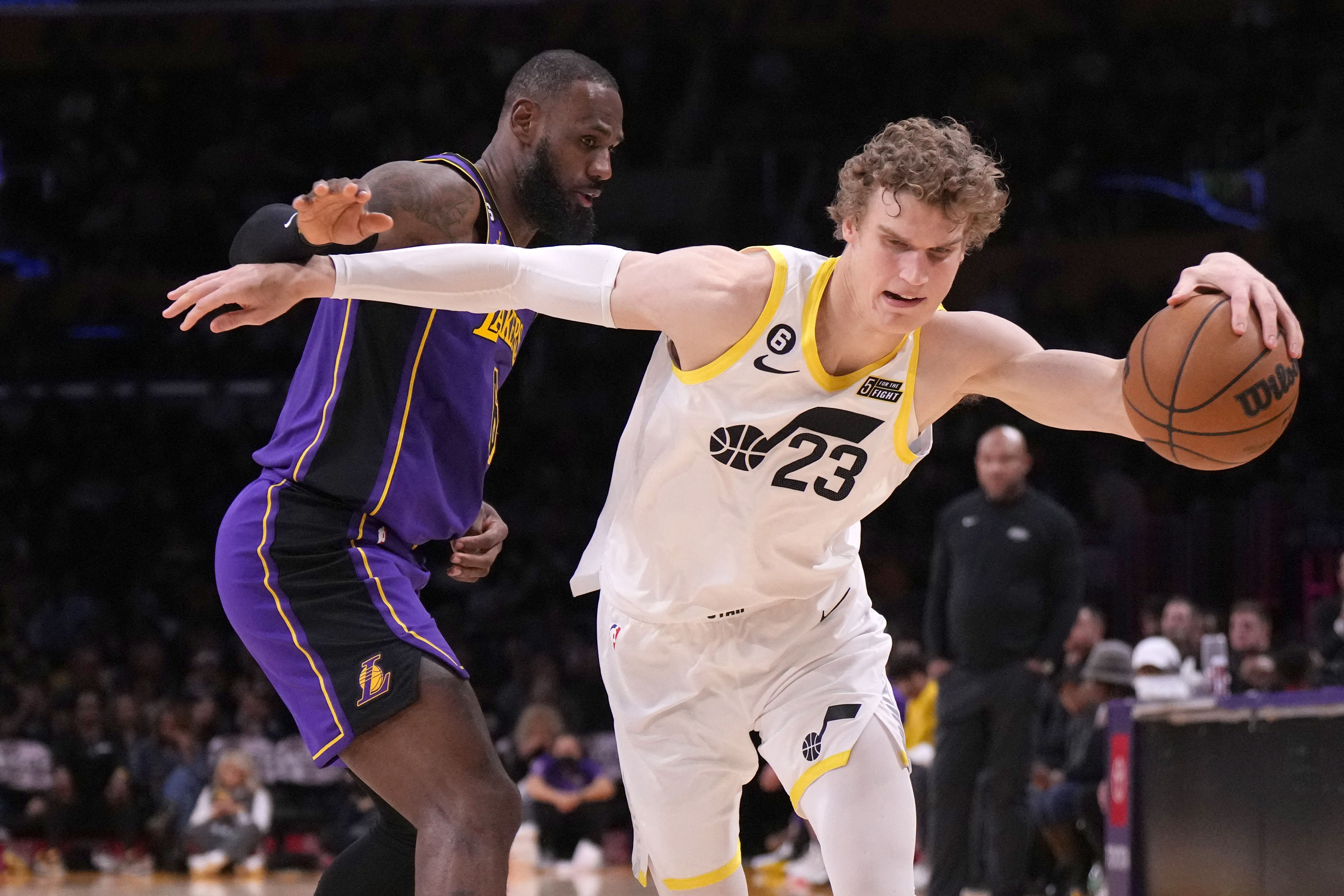 Nov 4, 2022; Los Angeles, California, USA; Utah Jazz forward Lauri Markkanen (23) dribbles the ball against Los Angeles Lakers forward LeBron James (6) in the second half at Crypto.com Arena. Mandatory Credit: Kirby Lee-USA TODAY Sports