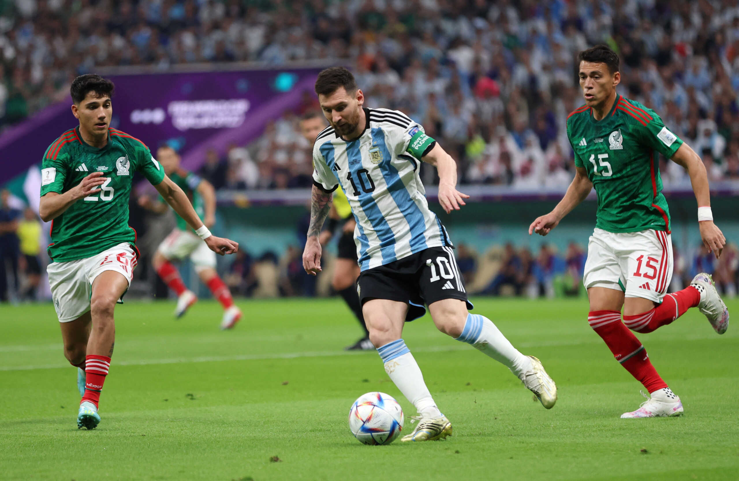 Soccer Football - FIFA World Cup Qatar 2022 - Group C - Argentina v Mexico - Lusail Stadium, Lusail, Qatar - November 26, 2022 Argentina's Lionel Messi in action with Mexico's Kevin Alvarez and Hector Moreno REUTERS
