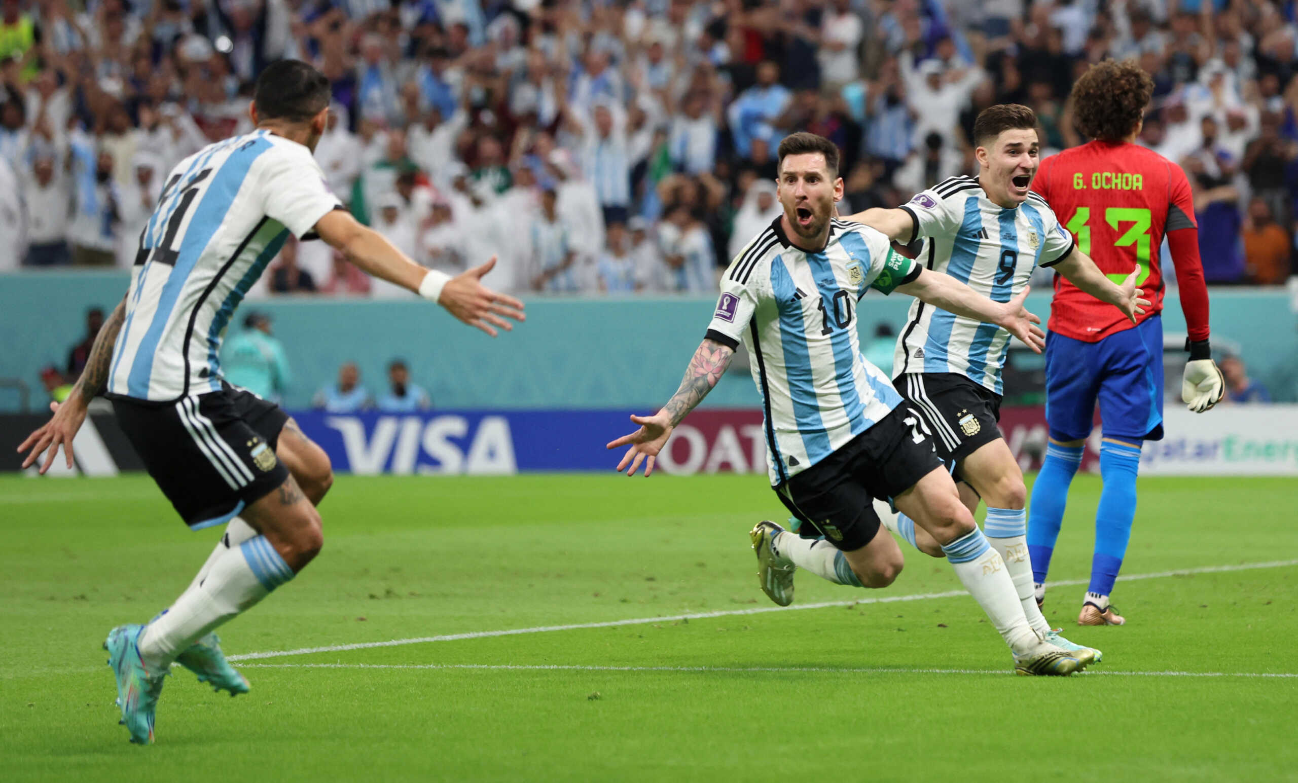 Soccer Football - FIFA World Cup Qatar 2022 - Group C - Argentina v Mexico - Lusail Stadium, Lusail, Qatar - November 26, 2022 Argentina's Lionel Messi celebrates scoring their first goal with Julian Alvarez and Angel Di Maria REUTERS