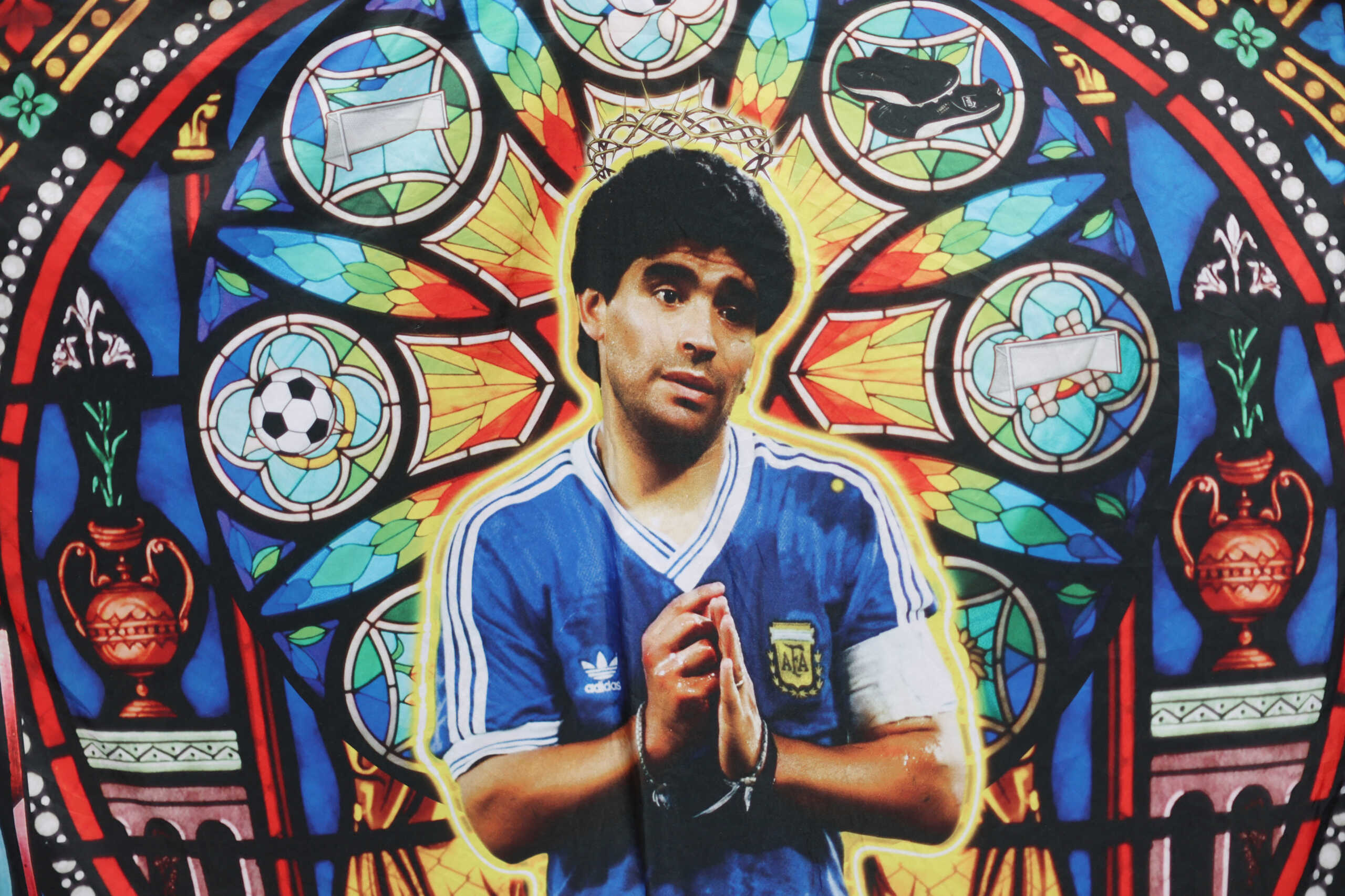 Soccer Football - FIFA World Cup Qatar 2022 - Group C - Argentina v Saudi Arabia - Lusail Stadium, Lusail, Qatar - November 22, 2022 A flag displaying former Argentina player Diego Maradona is pictured inside the stadium before the match REUTERS
