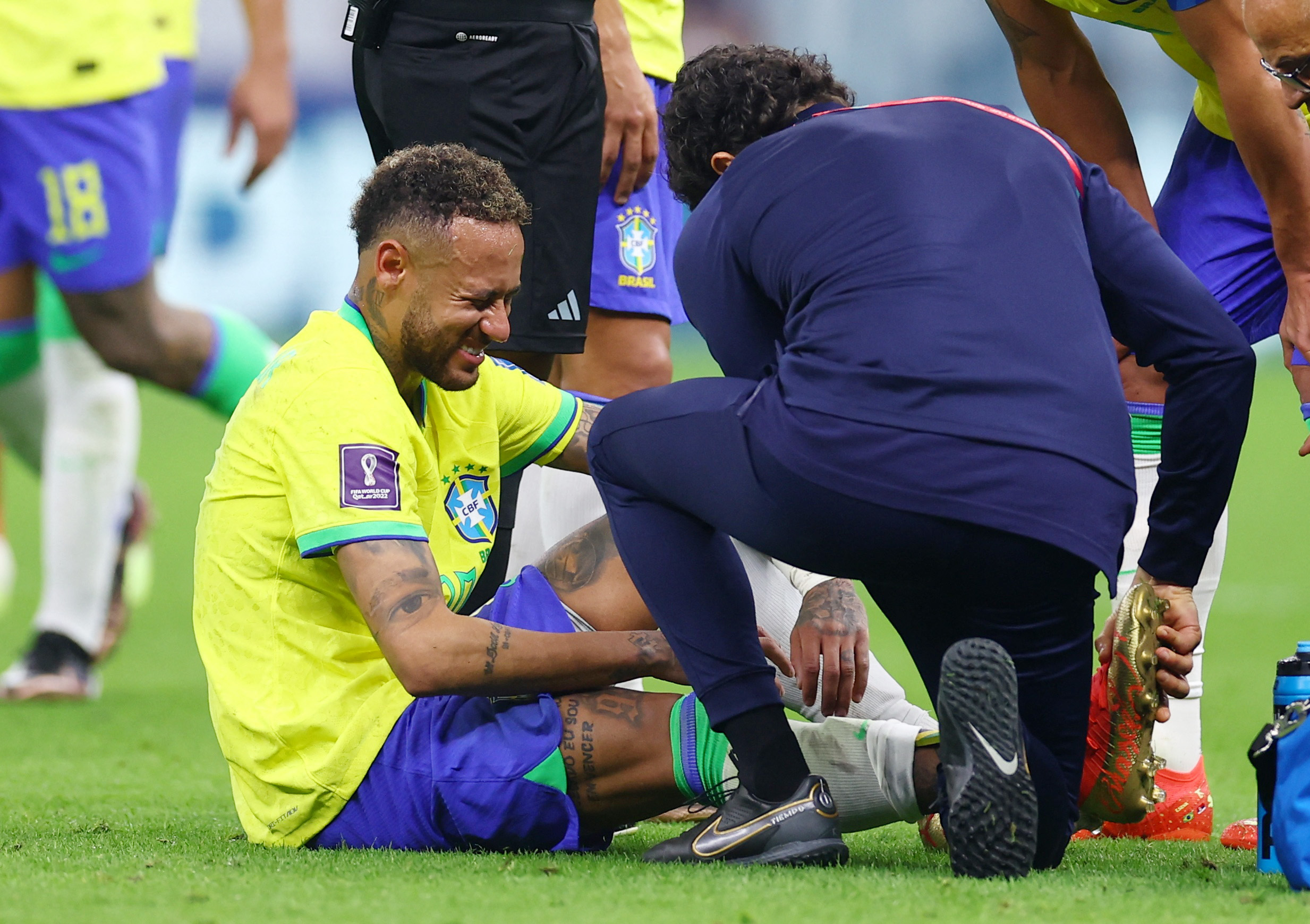 Soccer Football - FIFA World Cup Qatar 2022 - Group G - Brazil v Serbia - Lusail Stadium, Lusail, Qatar - November 24, 2022  Brazil's Neymar receives medical attention after sustaining an injury REUTERS