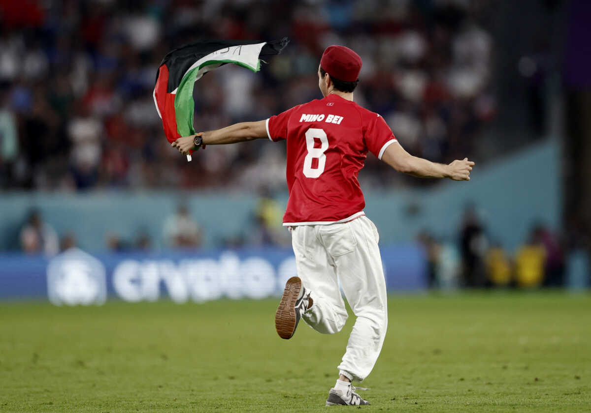 Soccer Football - FIFA World Cup Qatar 2022 - Group D - Tunisia v France - Education City Stadium, Al Rayyan, Qatar - November 30, 2022 A pitch invader runs onto the pitch REUTERS