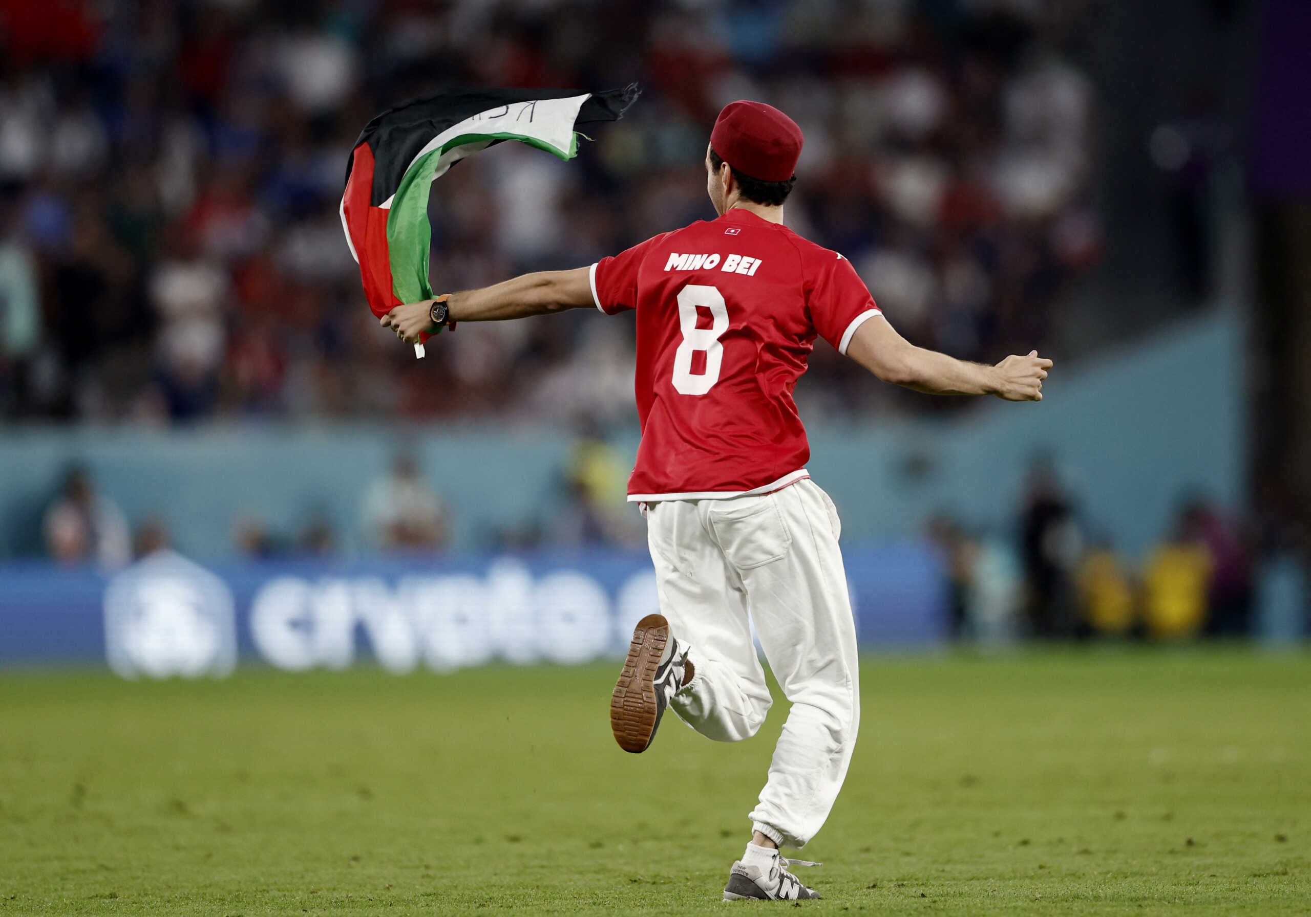 Soccer Football - FIFA World Cup Qatar 2022 - Group D - Tunisia v France - Education City Stadium, Al Rayyan, Qatar - November 30, 2022 A pitch invader runs onto the pitch REUTERS