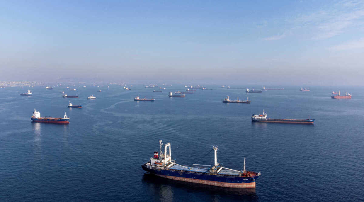 FILE PHOTO: Commercial vessels including vessels which are part of Black Sea grain deal wait to pass the Bosphorus strait off the shores of Yenikapi during a misty morning in Istanbul, Turkey, October 31, 2022. REUTERS