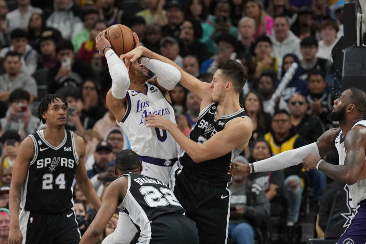Nov 26, 2022; San Antonio, Texas, USA;  San Antonio Spurs forward Zach Collins (23) commits a flagrant foul against Los Angeles Lakers guard Russell Westbrook (0) in the second half at the AT&T Center. Mandatory Credit: Daniel Dunn-USA TODAY Sports