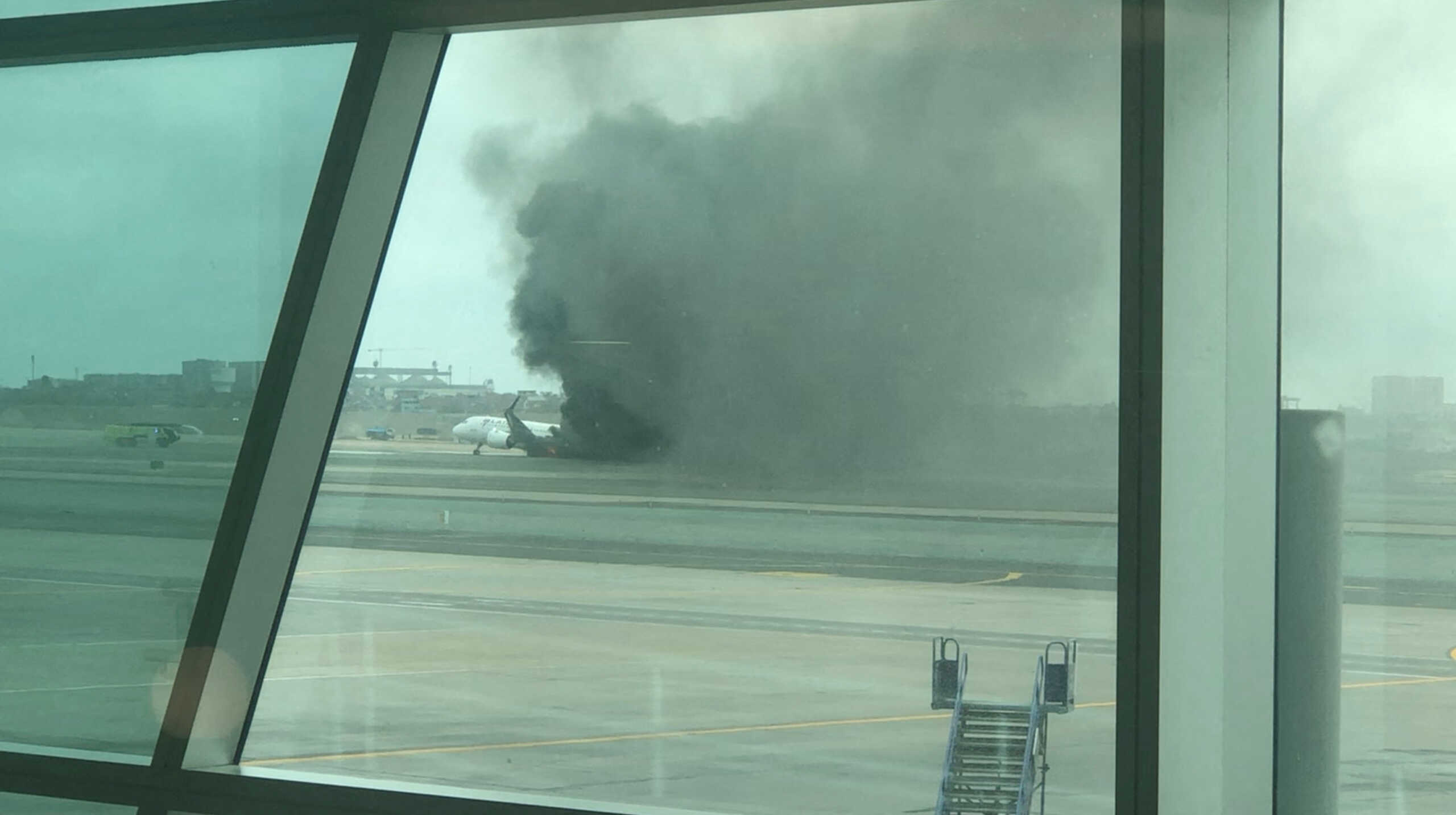 Thick smoke rises from a LATAM Airlines LTM.SN jet after it collided with a firetruck on the runway of Peru's Jorge Chavez International Airport as it was taking off, in Callao, Peru, November 18, 2022, in this still image taken from a video obtained from social media. Mauro A. Ferreira