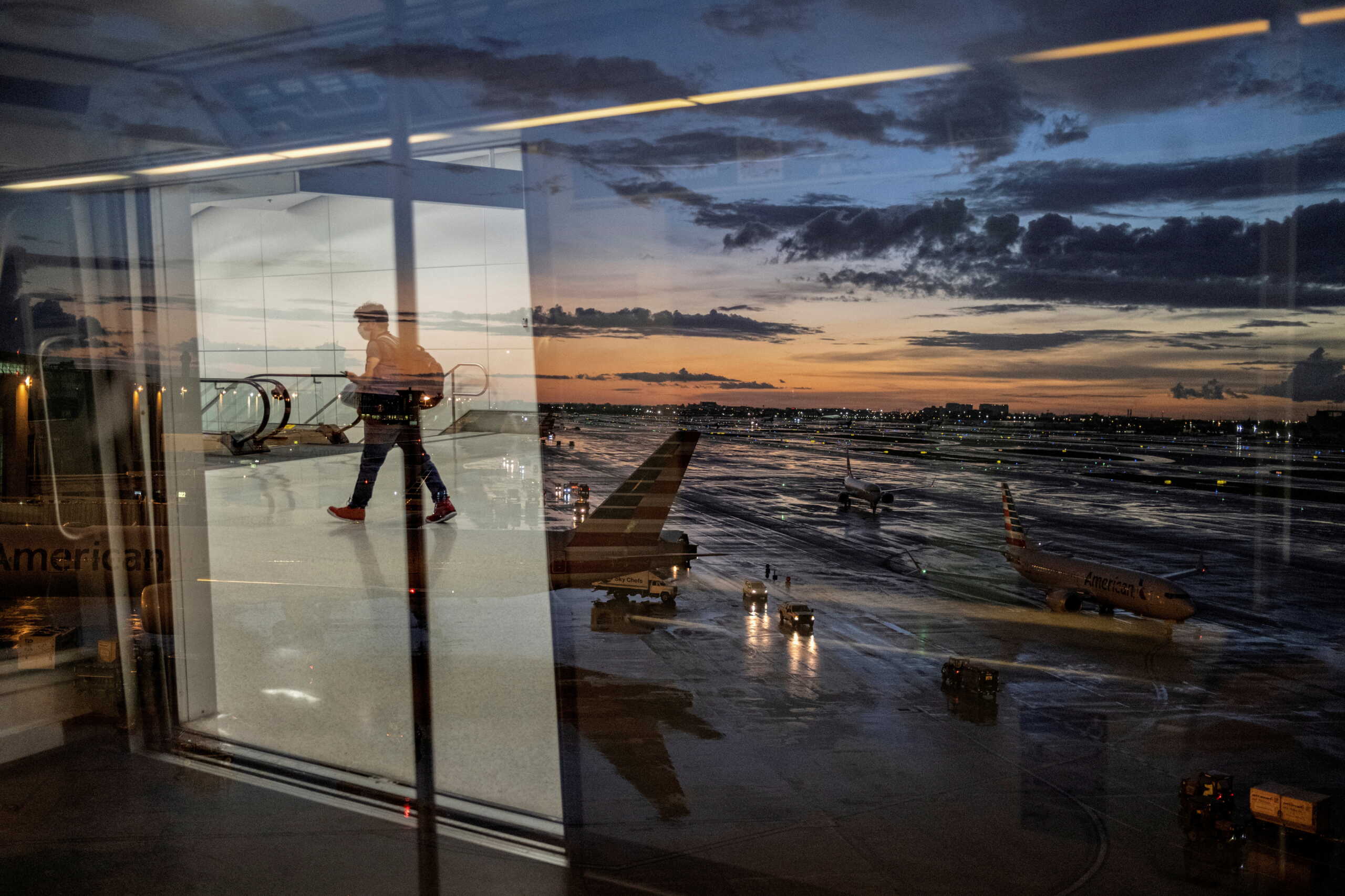 A passenger arrives at terminal D of Miami International Airport after heavy rains, as Hurricane Elsa moves towards south Florida, in Miami, U.S. July 2, 2021. Picture taken July 2, 2021. REUTERS