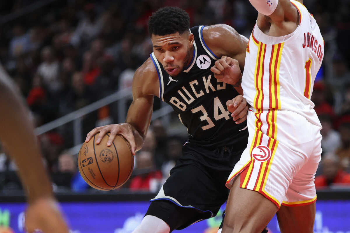Nov 7, 2022; Atlanta, Georgia, USA; Milwaukee Bucks forward Giannis Antetokounmpo (34) is defended by Atlanta Hawks forward Jalen Johnson (1) in the fourth quarter at State Farm Arena. Mandatory Credit: Brett Davis-USA TODAY Sports