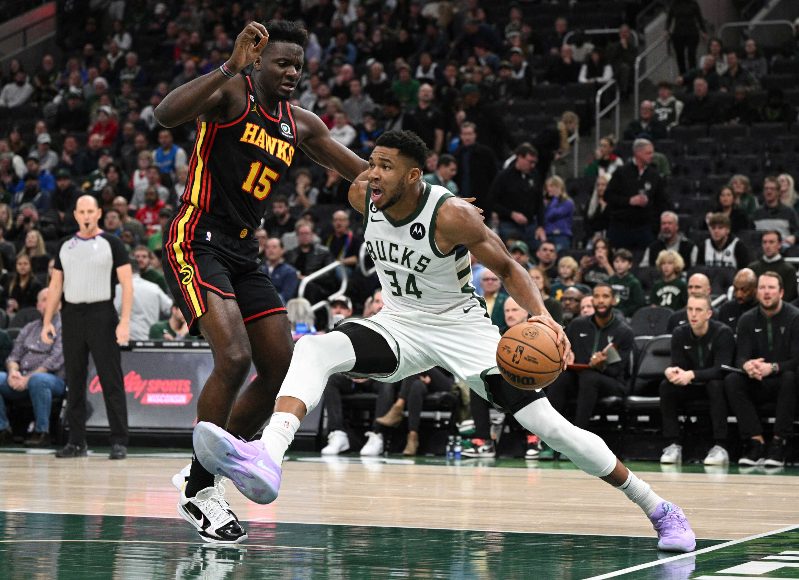 Nov 14, 2022; Milwaukee, Wisconsin, USA; Milwaukee Bucks forward Giannis Antetokounmpo (34) drives to the basket against Atlanta Hawks center Clint Capela (15) in the first quarter at Fiserv Forum. Mandatory Credit: Michael McLoone-USA TODAY Sports
