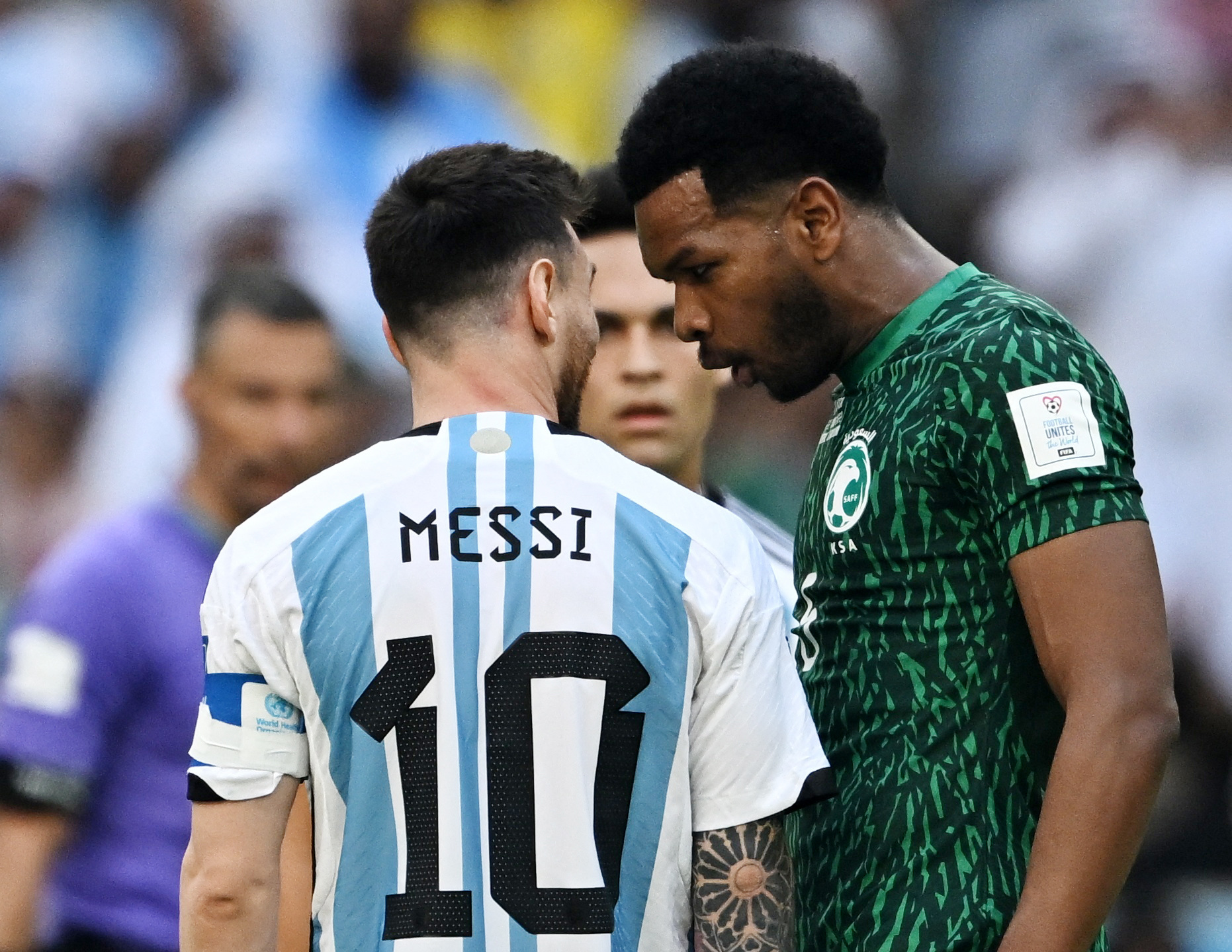 Soccer Football - FIFA World Cup Qatar 2022 - Group C - Argentina v Saudi Arabia - Lusail Stadium, Lusail, Qatar - November 22, 2022  Argentina's Lionel Messi speaks with Saudi Arabia's Ali Al Bulayhi REUTERS