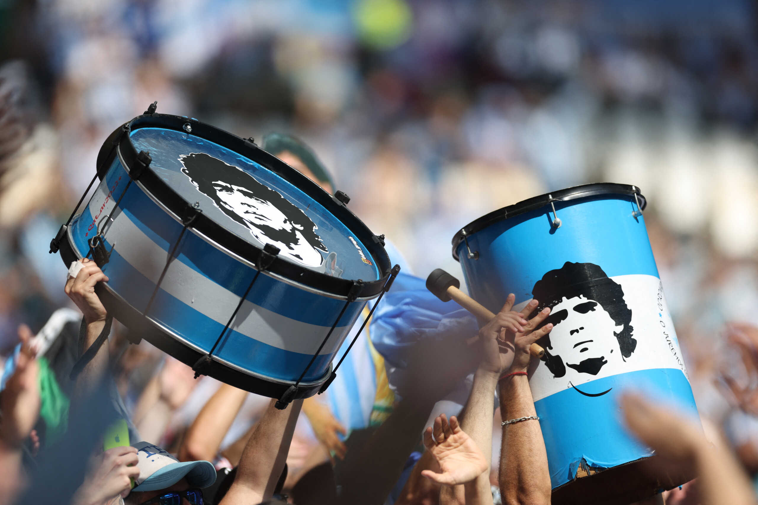 Soccer Football - FIFA World Cup Qatar 2022 - Group C - Argentina v Saudi Arabia - Lusail Stadium, Lusail, Qatar - November 22, 2022 Argentina fans hold drums displaying Diego Maradona inside the stadium before the match REUTERS