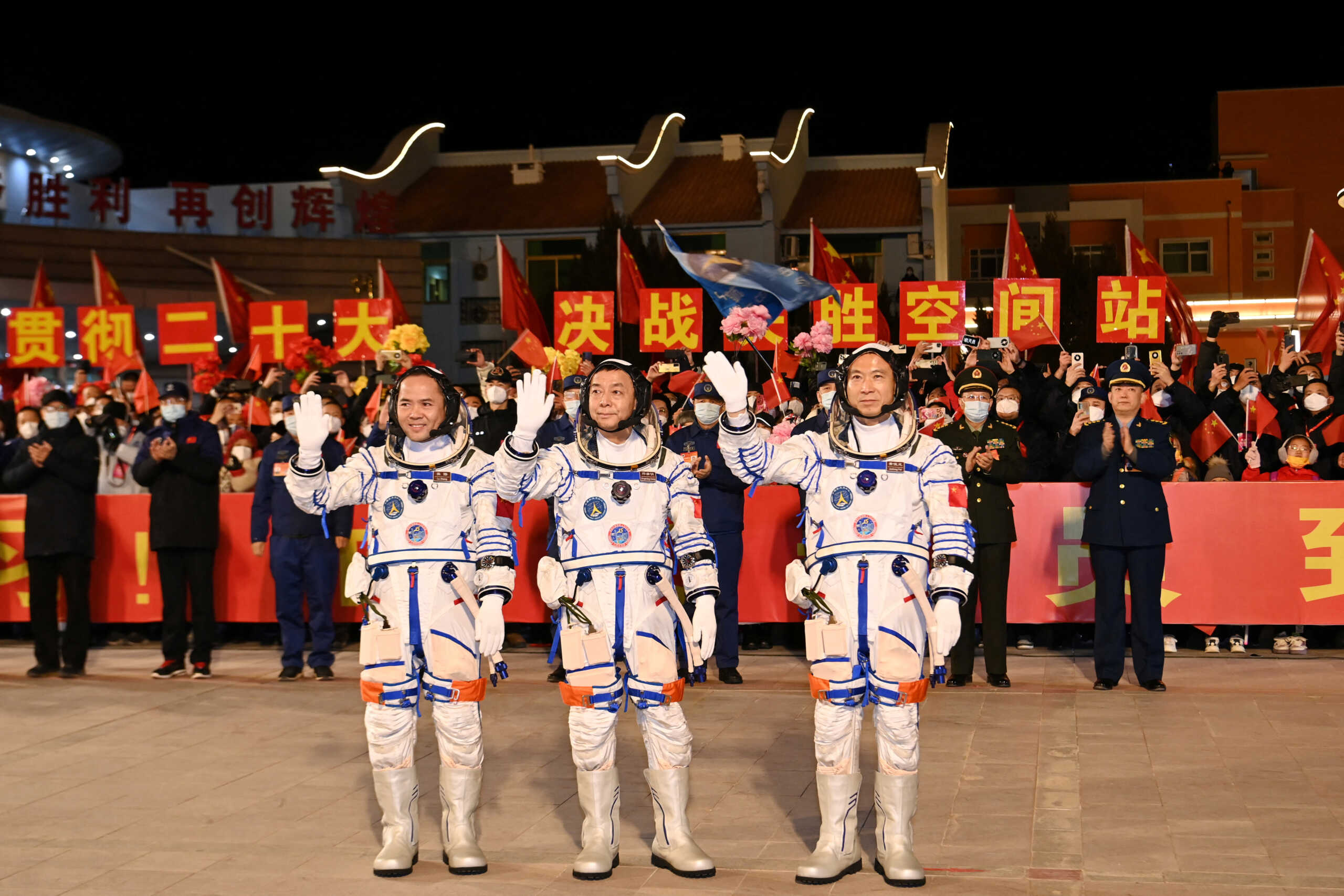 Astronauts Fei Junlong, Deng Qingming and Zhang Lu attend a see-off ceremony before the Shenzhou-15 spaceflight mission to build China's space station, at Jiuquan Satellite Launch Center, near Jiuquan, Gansu province, China September 29, 2022. cnsphoto via REUTERS   ATTENTION EDITORS - THIS IMAGE WAS PROVIDED BY A THIRD PARTY. CHINA OUT.