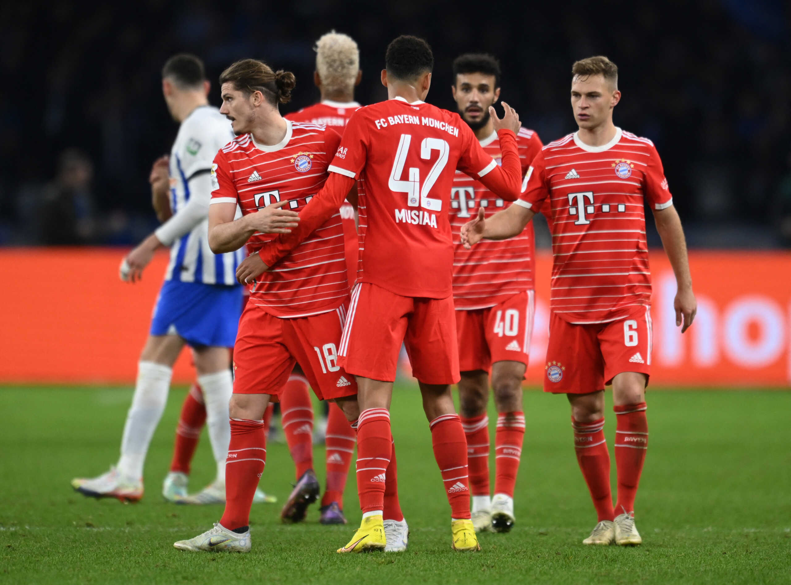Soccer Football - Bundesliga - Hertha BSC v Bayern Munich - Olympiastadion, Berlin, Germany - November 5, 2022 Bayern Munich's Jamal Musiala celebrates after the match with Joshua Kimmich and Marcel Sabitzer REUTERS