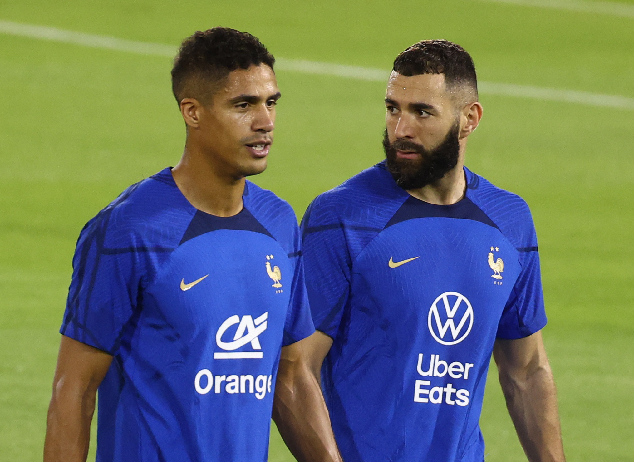 Soccer Football - FIFA World Cup Qatar 2022 - France Training - Al Sadd SC Stadium, Doha, Qatar - November 17, 2022 France's Raphael Varane and Karim Benzema during training REUTERS