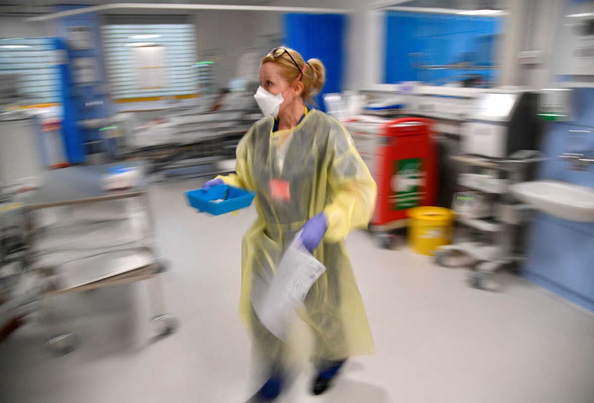 FILE PHOTO: A nurse treats COVID-19 patients in the ICU (Intensive Care Unit) at Milton Keynes University Hospital, amid the spread of the coronavirus disease (COVID-19) pandemic, Milton Keynes, Britain, January 20, 2021. Picture taken January 20, 2021. REUTERS