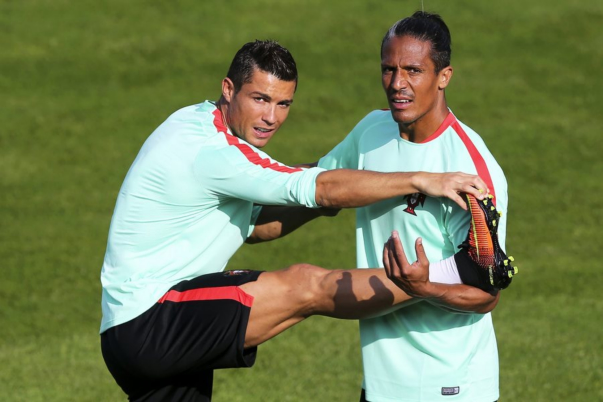 epa05353657 Portuguese national soccer team players Cristiano Ronaldo (L) and Bruno Alves (R) attend their team's training session in Marcoussis, France, 09 June 2016. The Portuguese team prepares for the UEFA EURO 2016 soccer championship that starts on 10 June 2016.  EPA