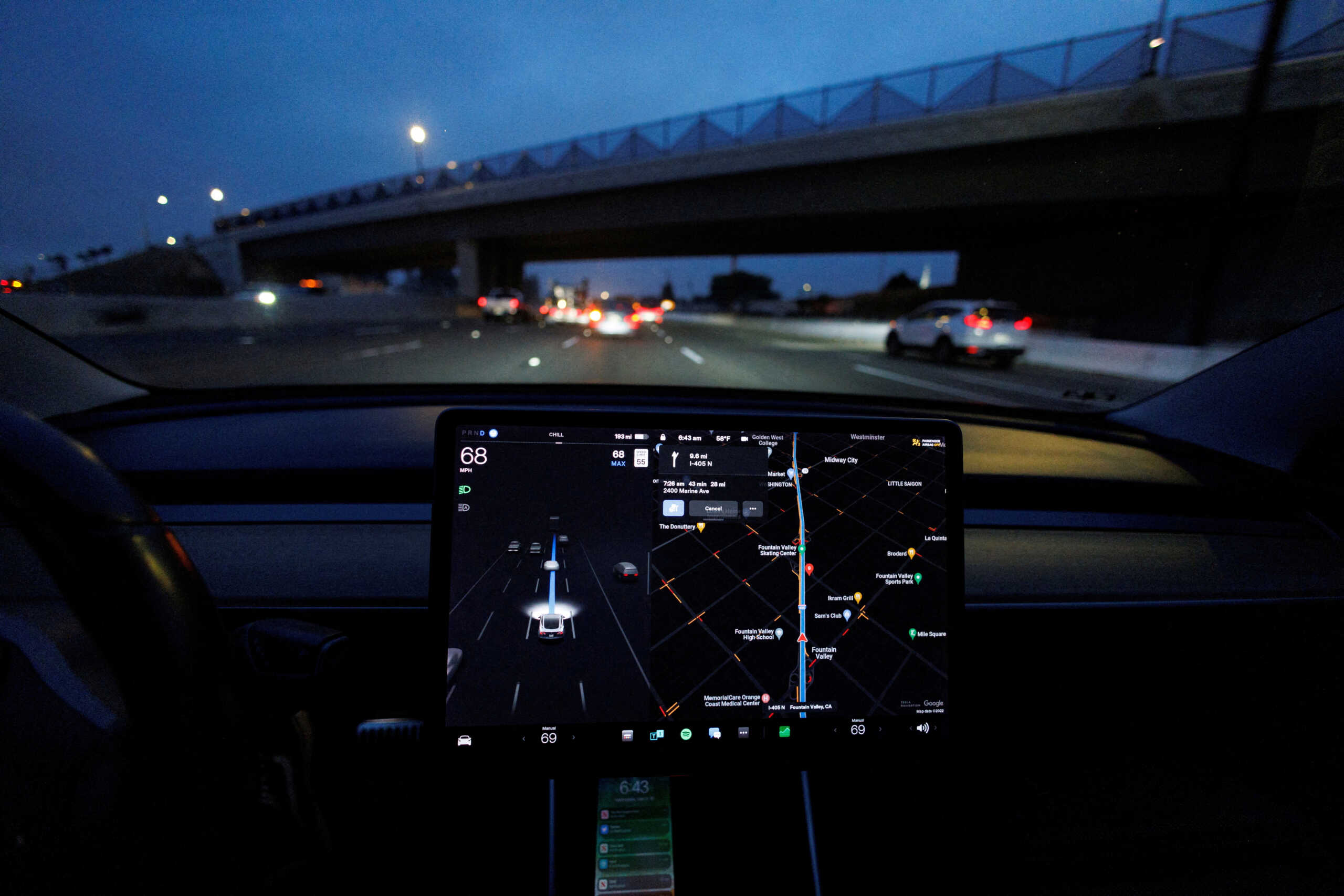 FILE PHOTO: A Tesla Model 3 vehicle drives on autopilot along the 405 highway in Westminster, California, U.S., March 16, 2022. REUTERS