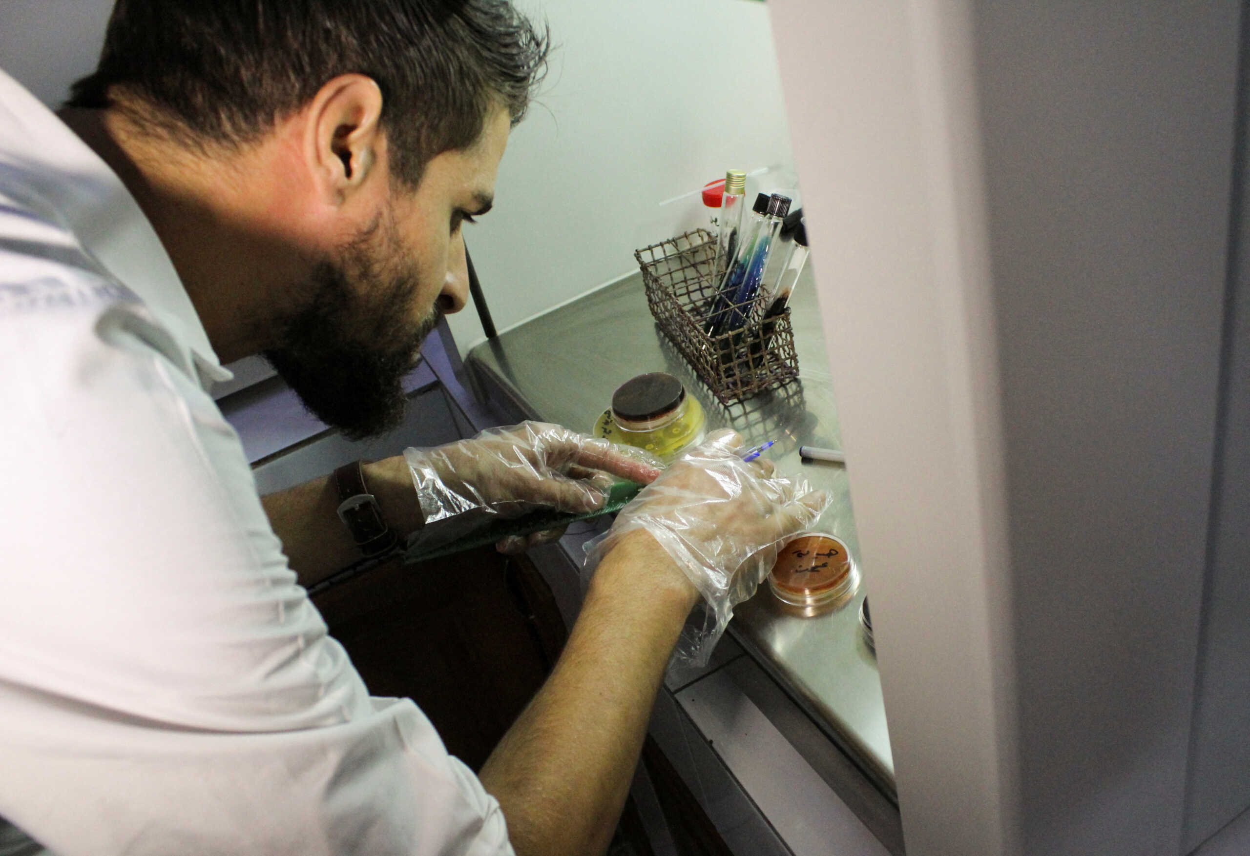 A medical practitioner works at a laboratory inside Ibn al-Nafis hospital in Damascus, Syria November 8, 2022. REUTERS