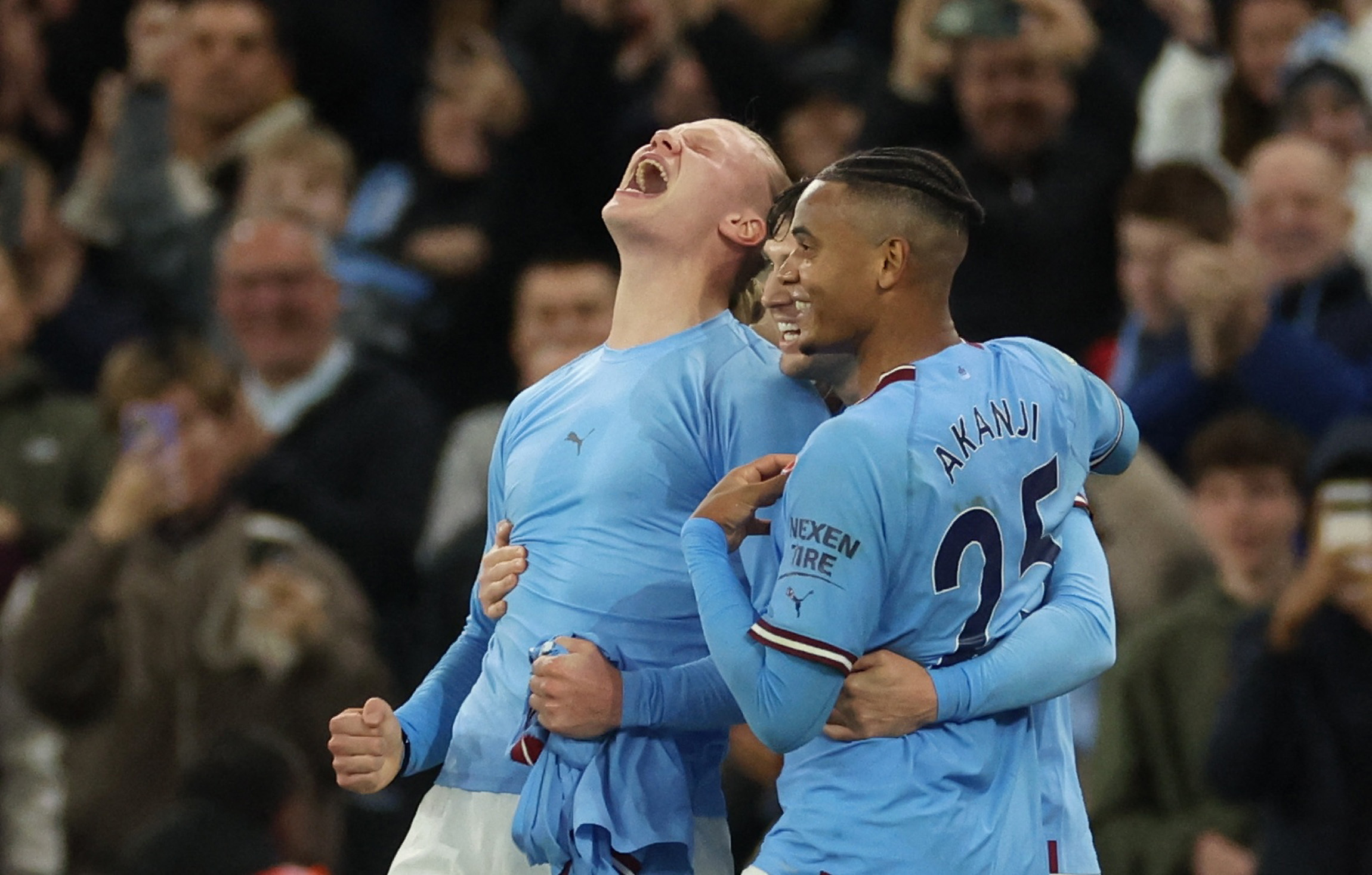 Soccer Football - Premier League - Manchester City v Fulham - Etihad Stadium, Manchester, Britain - November 5, 2022 Manchester City's Erling Braut Haaland celebrates scoring their second goal with John Stones and Manuel Akanji REUTERS