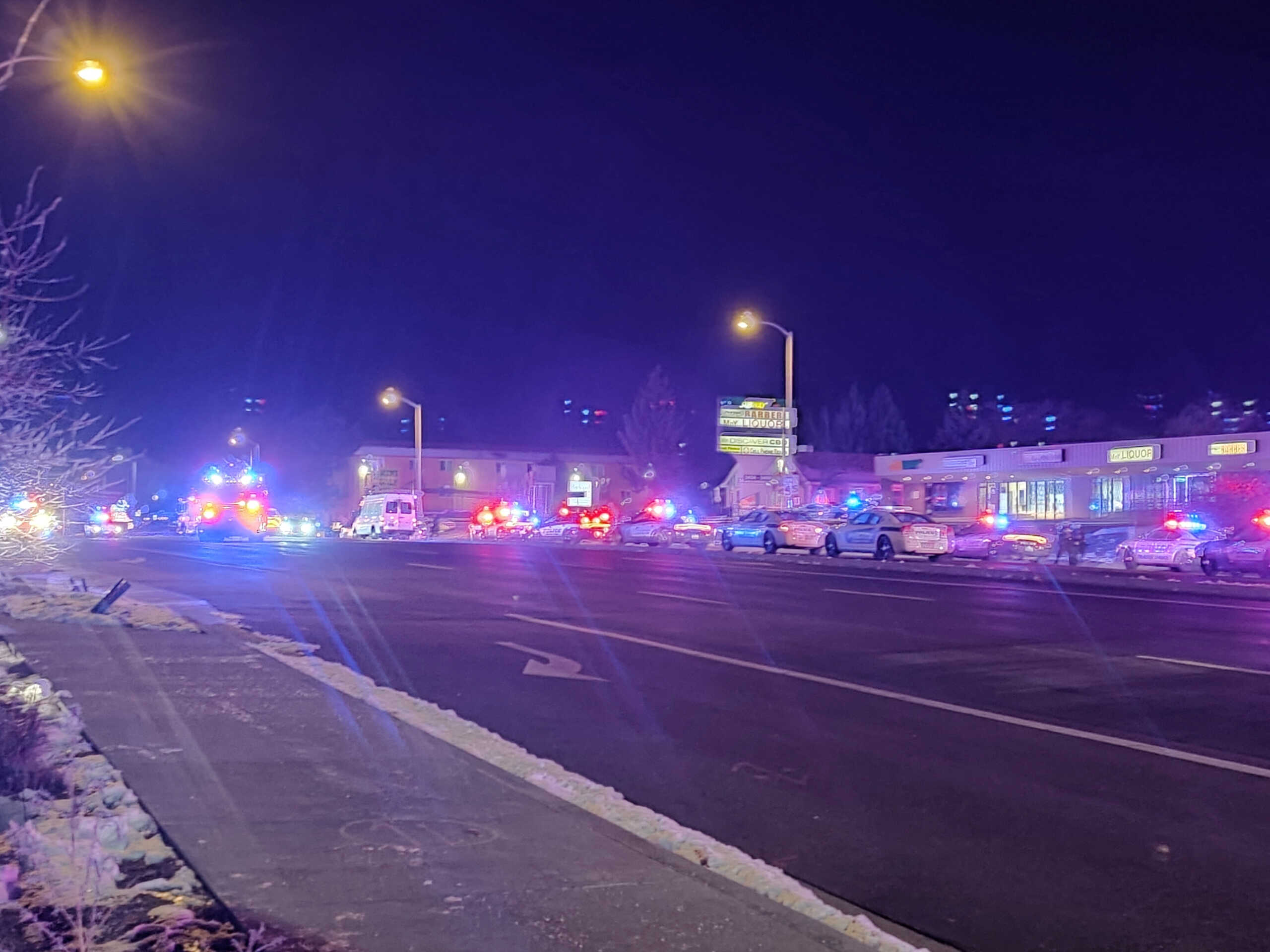 A view of various security and emergency vehicles with flashing blinkers parked on a street, after a shooting in a club, in Colarado Springs, Colorado, U.S November 20, 2022, in this picture obtained from social media. in this picture obtained from social media. Trey Deabueno