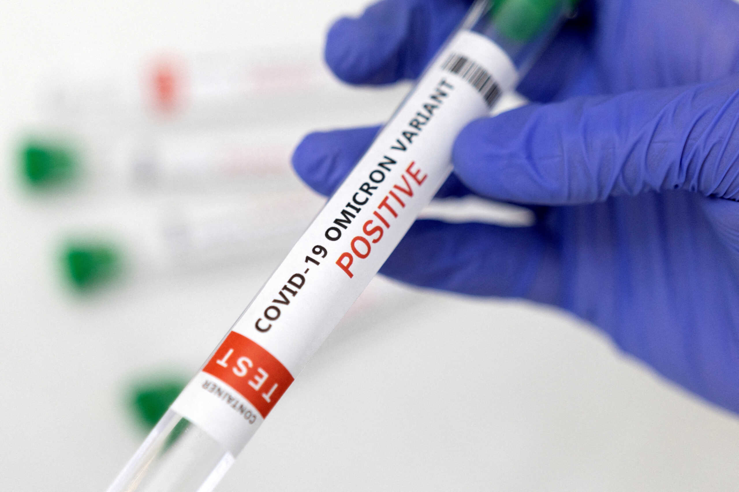 FILE PHOTO: Test tube labelled "COVID-19 Omicron variant test positive" is seen in this illustration picture taken January 15, 2022. REUTERS