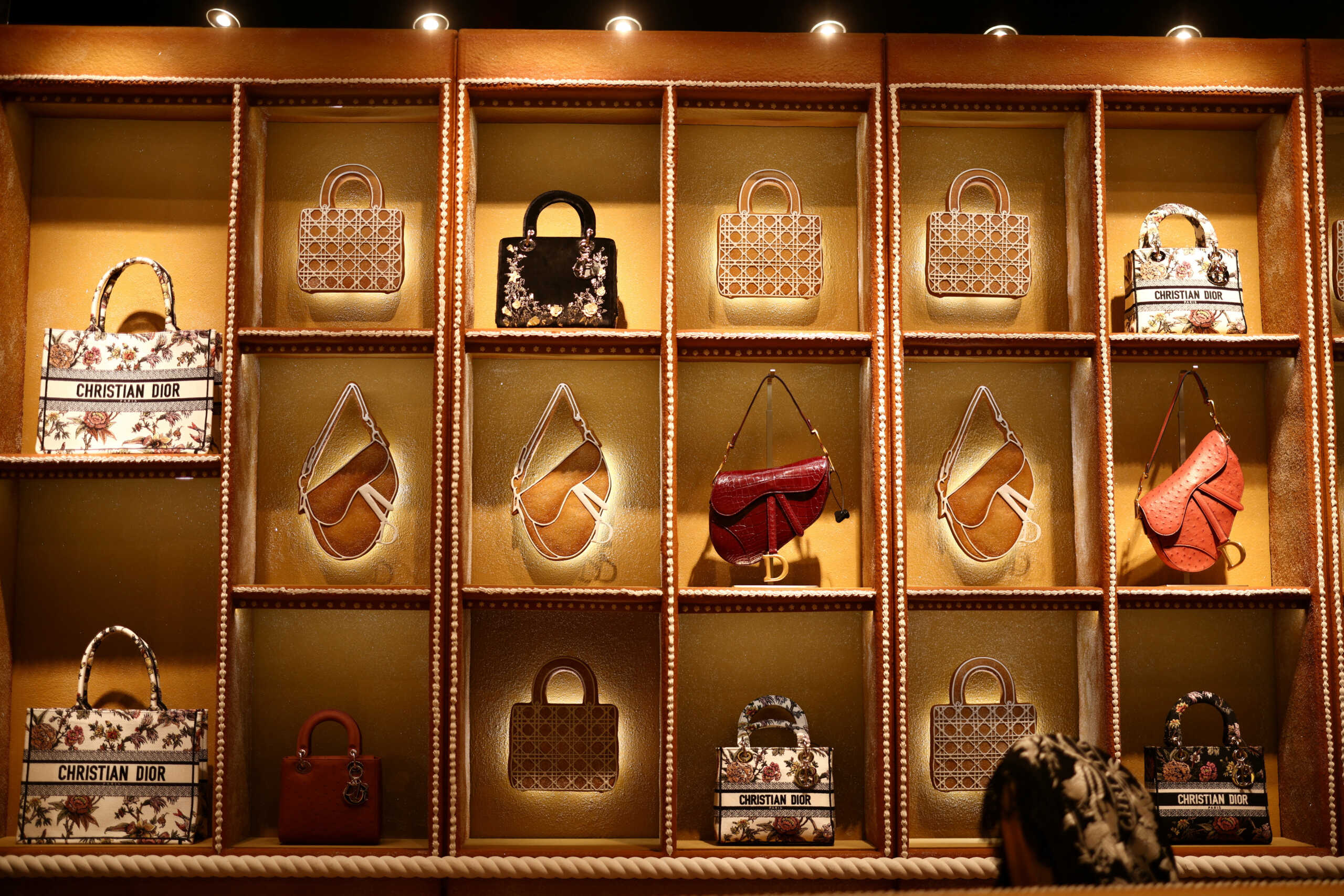 Items lie on display at a gingerbread themed pop-up store as part of ‘The Fabulous World of Dior’ installation at the Harrods store in London, Britain, November 10, 2022. REUTERS