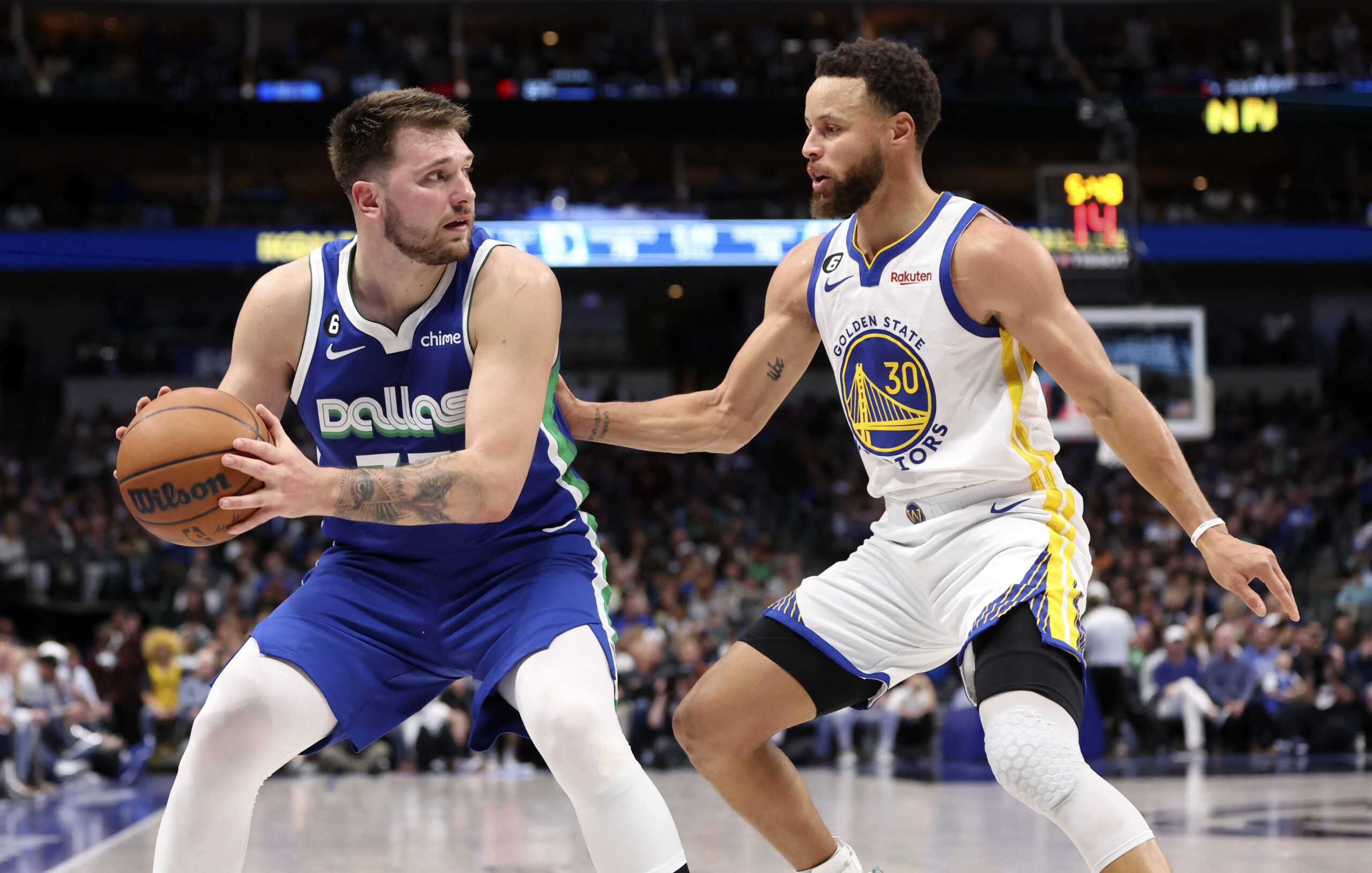 Nov 29, 2022; Dallas, Texas, USA;  Dallas Mavericks guard Luka Doncic (77) looks to score as Golden State Warriors guard Stephen Curry (30) defends during the second half at American Airlines Center. Mandatory Credit: Kevin Jairaj-USA TODAY Sports