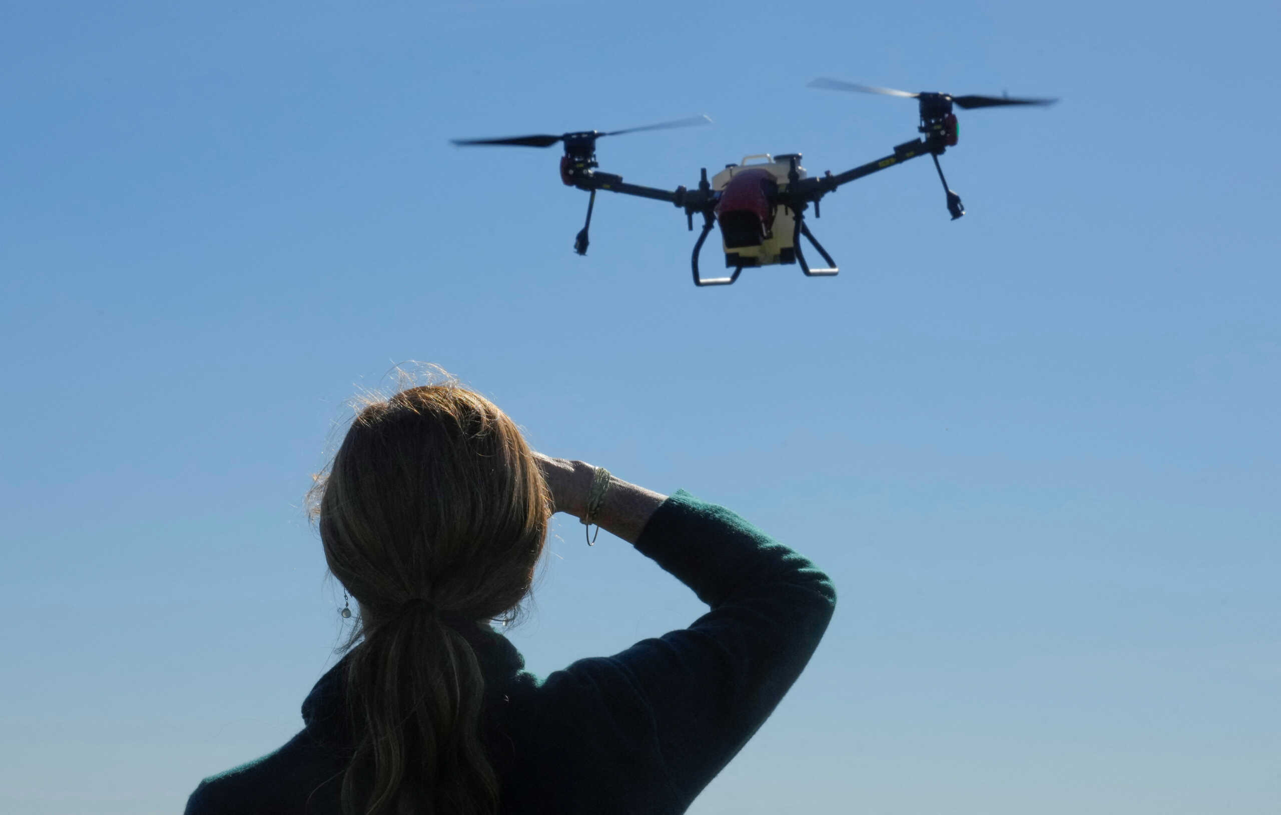 USAID Administrator Samantha Power observes drones which were received by local farmers from the USAID on the outskirts of Kyiv, Ukraine, October 6, 2022. Efrem Lukatsky