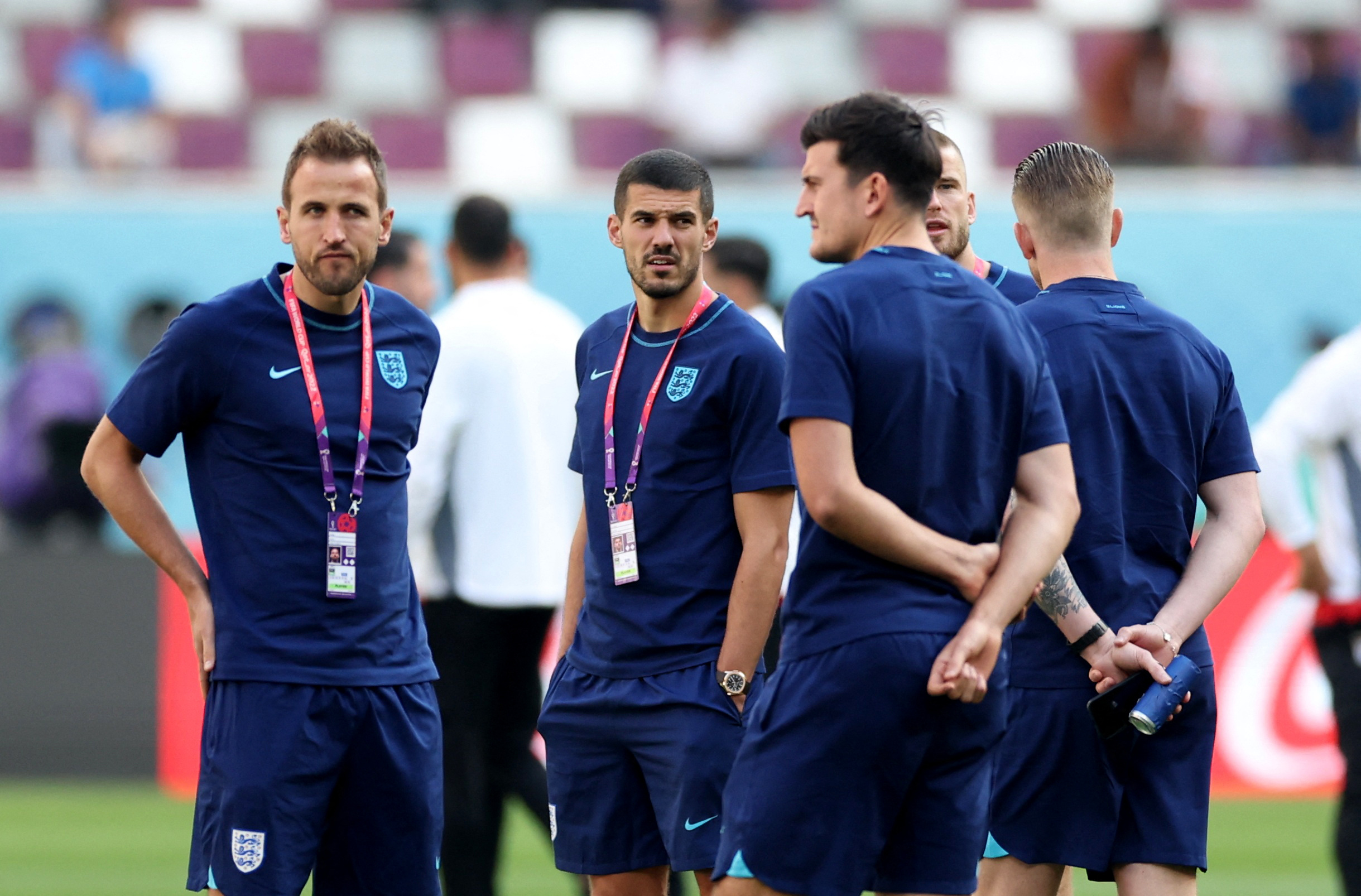 Soccer Football - FIFA World Cup Qatar 2022 - Group B - England v Iran - Khalifa International Stadium, Doha, Qatar - November 21, 2022 England's Harry Kane, Harry Maguire and Conor Coady with teammates on the pitch before the match REUTERS