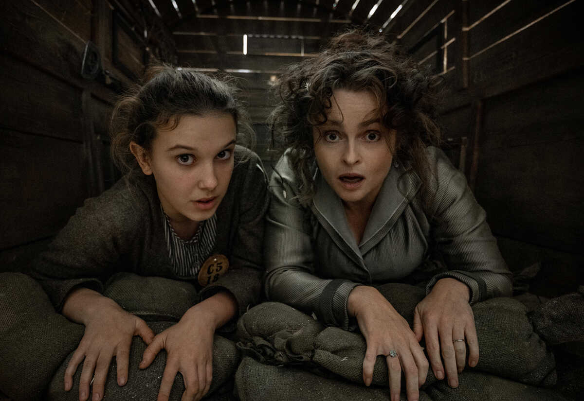 Enola Holmes 2. Millie Bobby Brown as Enola Holmes, Helena Bonham Carter as Eudoria Holmes. Cr. Alex Bailey