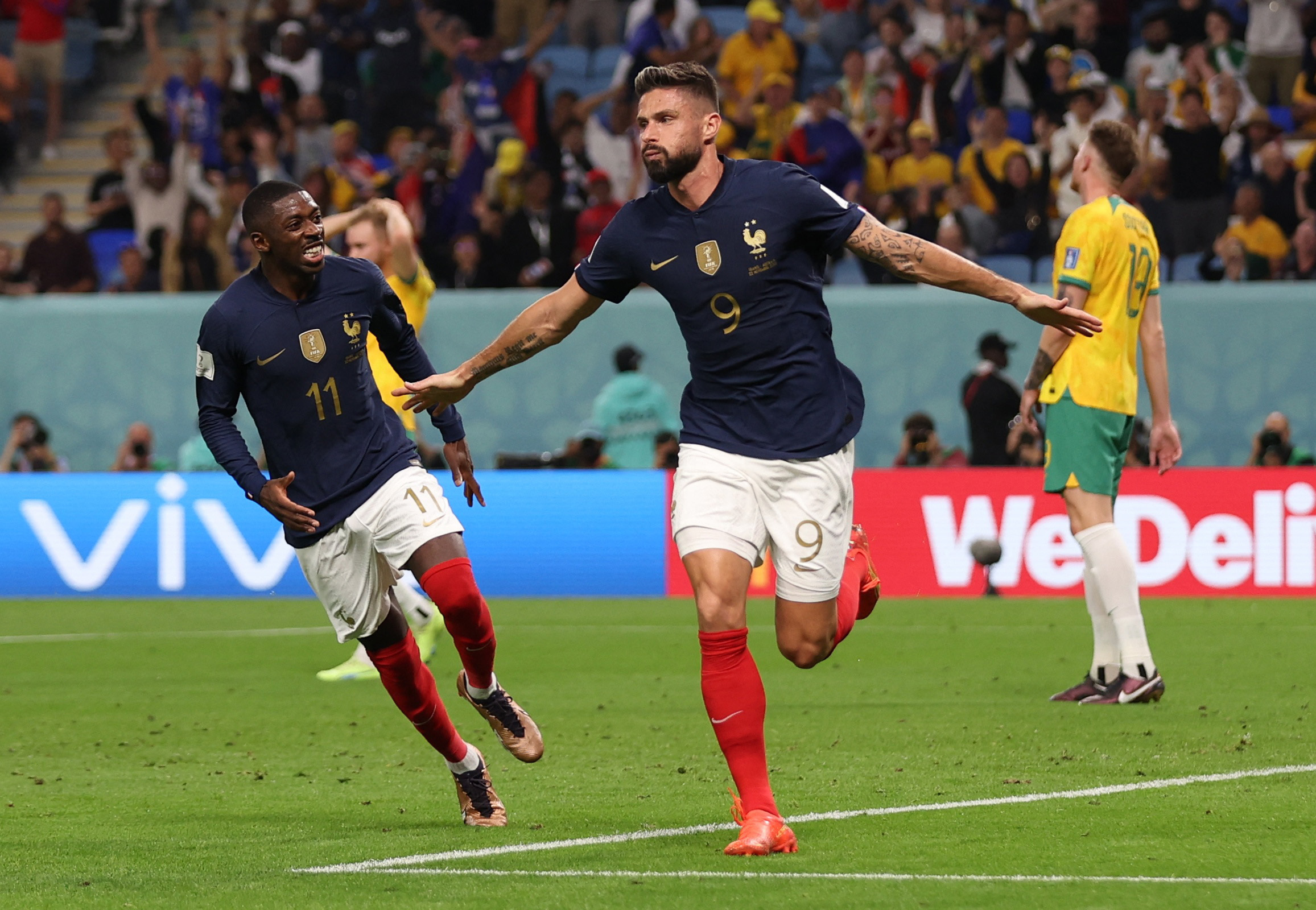 Soccer Football - FIFA World Cup Qatar 2022 - Group D - France v Australia - Al Janoub Stadium, Al Wakrah, Qatar - November 22, 2022 France's Olivier Giroud celebrates scoring their second goal with Ousmane Dembele REUTERS