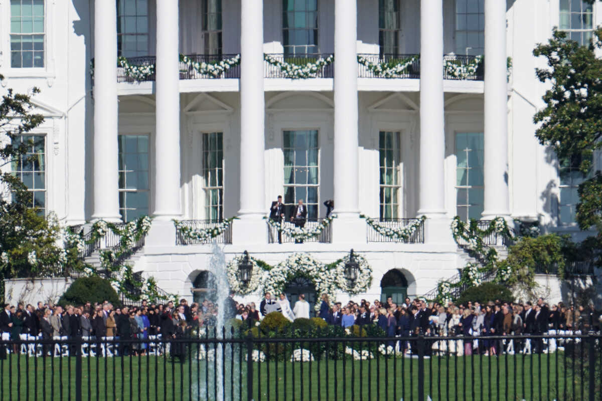 Naomi Biden, granddaughter of U.S. President Joe Biden, and Peter Neal, 25, center, are married on the South Lawn of the White House in Washington, D.C., U.S., November 19, 2022. REUTERS