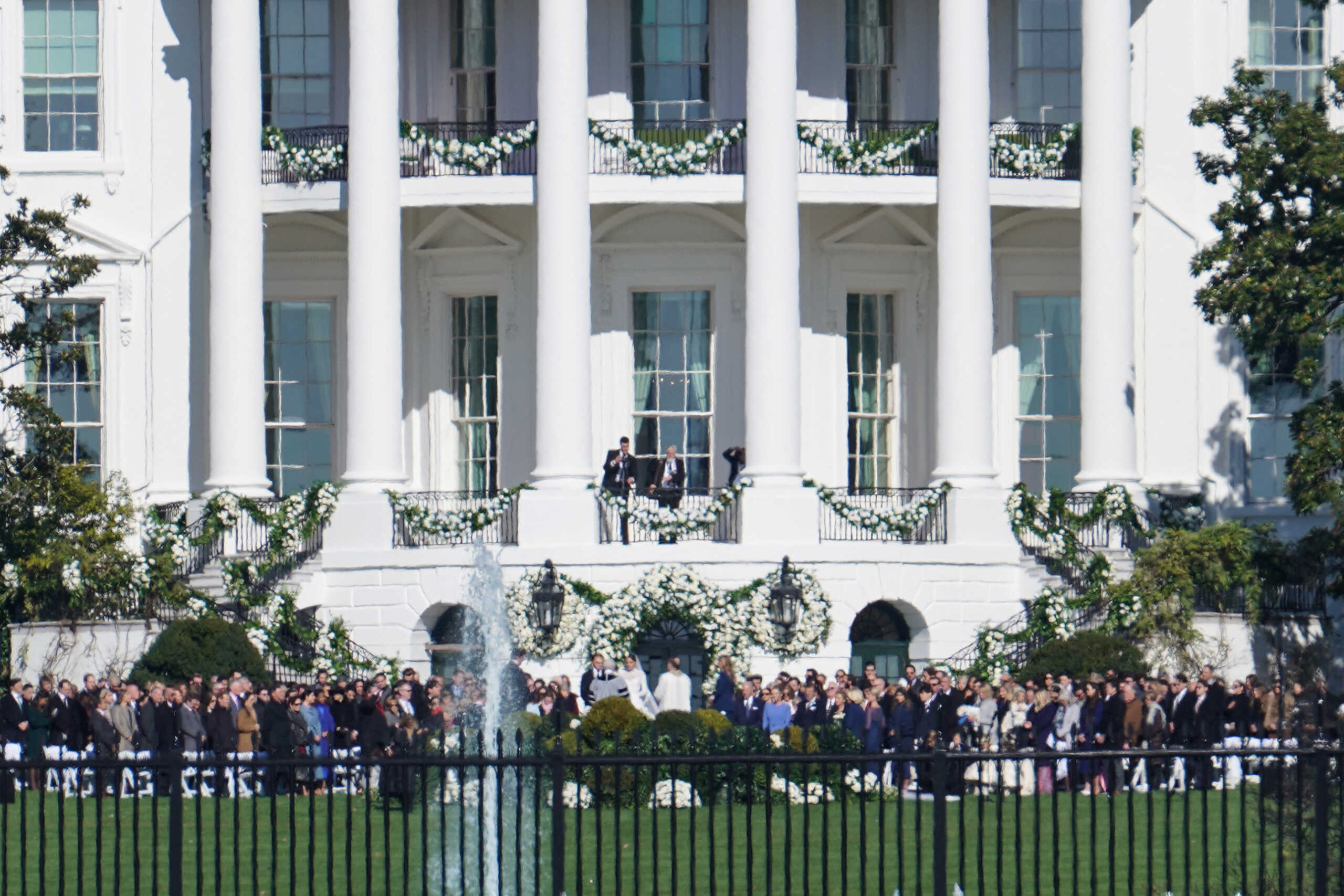 Naomi Biden, granddaughter of U.S. President Joe Biden, and Peter Neal, 25, center, are married on the South Lawn of the White House in Washington, D.C., U.S., November 19, 2022. REUTERS