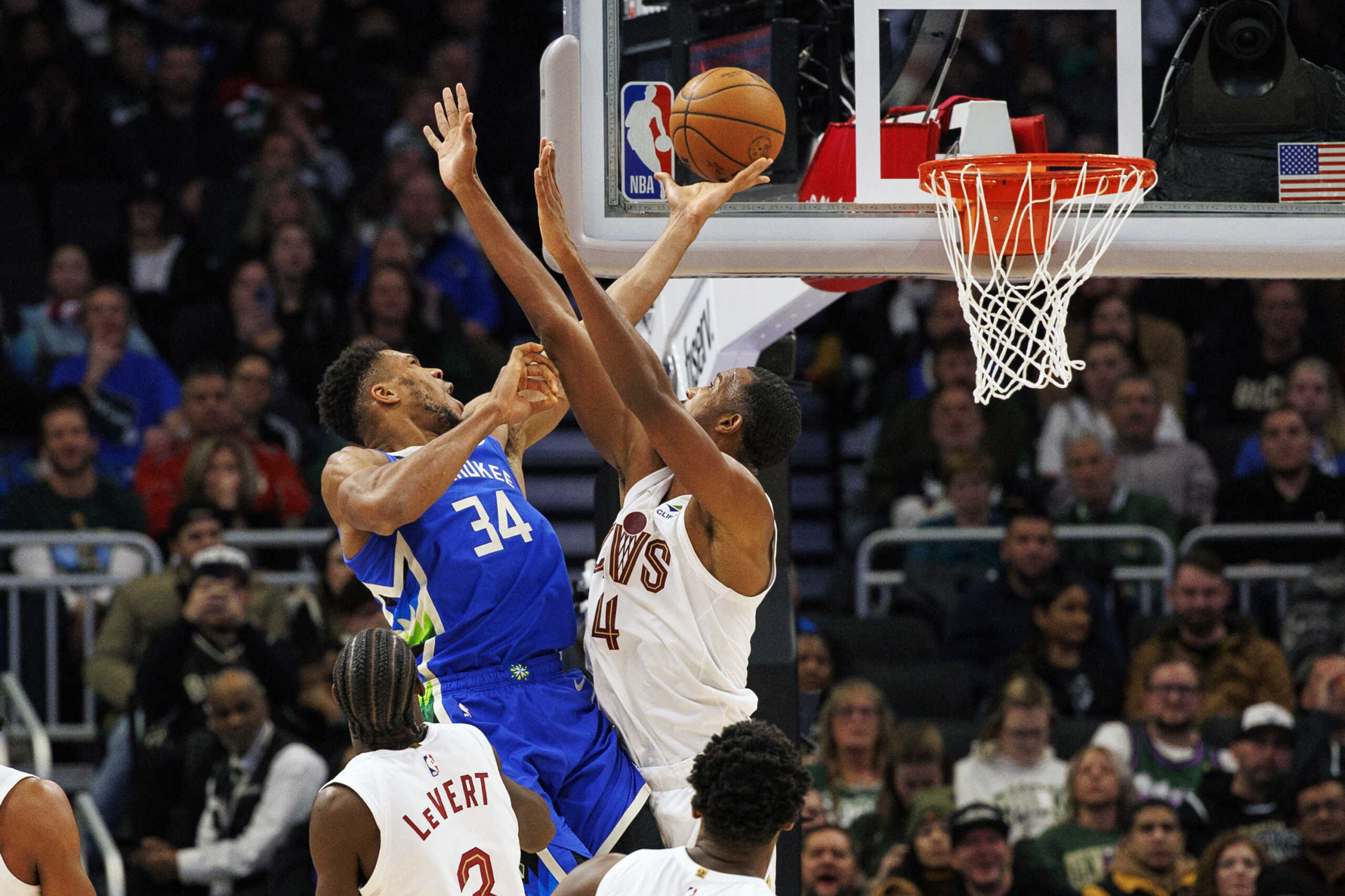 Nov 16, 2022; Milwaukee, Wisconsin, USA;  Milwaukee Bucks forward Giannis Antetokounmpo (34) shoots against Cleveland Cavaliers forward Evan Mobley (4) during the fourth quarter at Fiserv Forum. Mandatory Credit: Jeff Hanisch-USA TODAY Sports