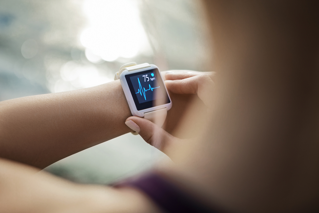 Sporty Woman Looking At Her Smart Watch