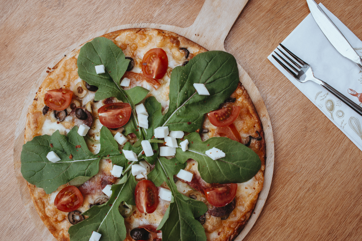 Mixed view of pizza with mozzarella cheese, tomato, sausage, arugula and vegetables on wooden background, Stock pizza photo, studio shot pizza