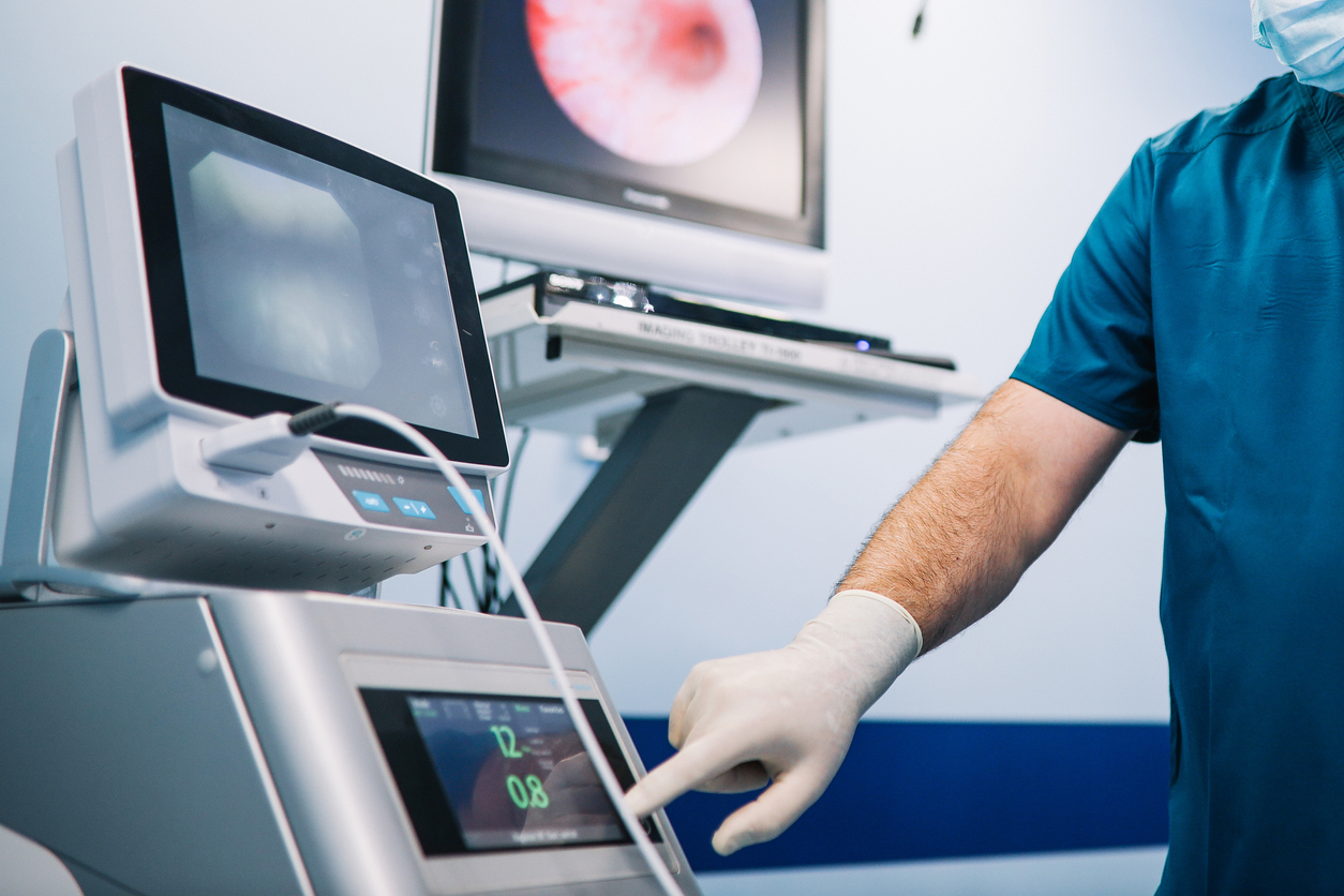 Image of a doctor preparing instruments and the medical room for the surgery.